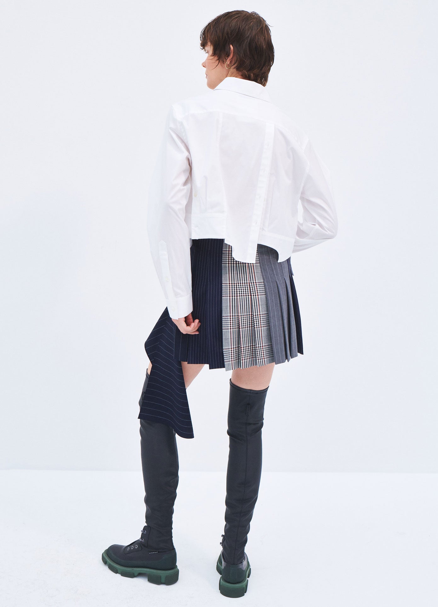 MONSE Spring 2024 Patchwork Pleated Mini Skirt in Black Multi on model full back view