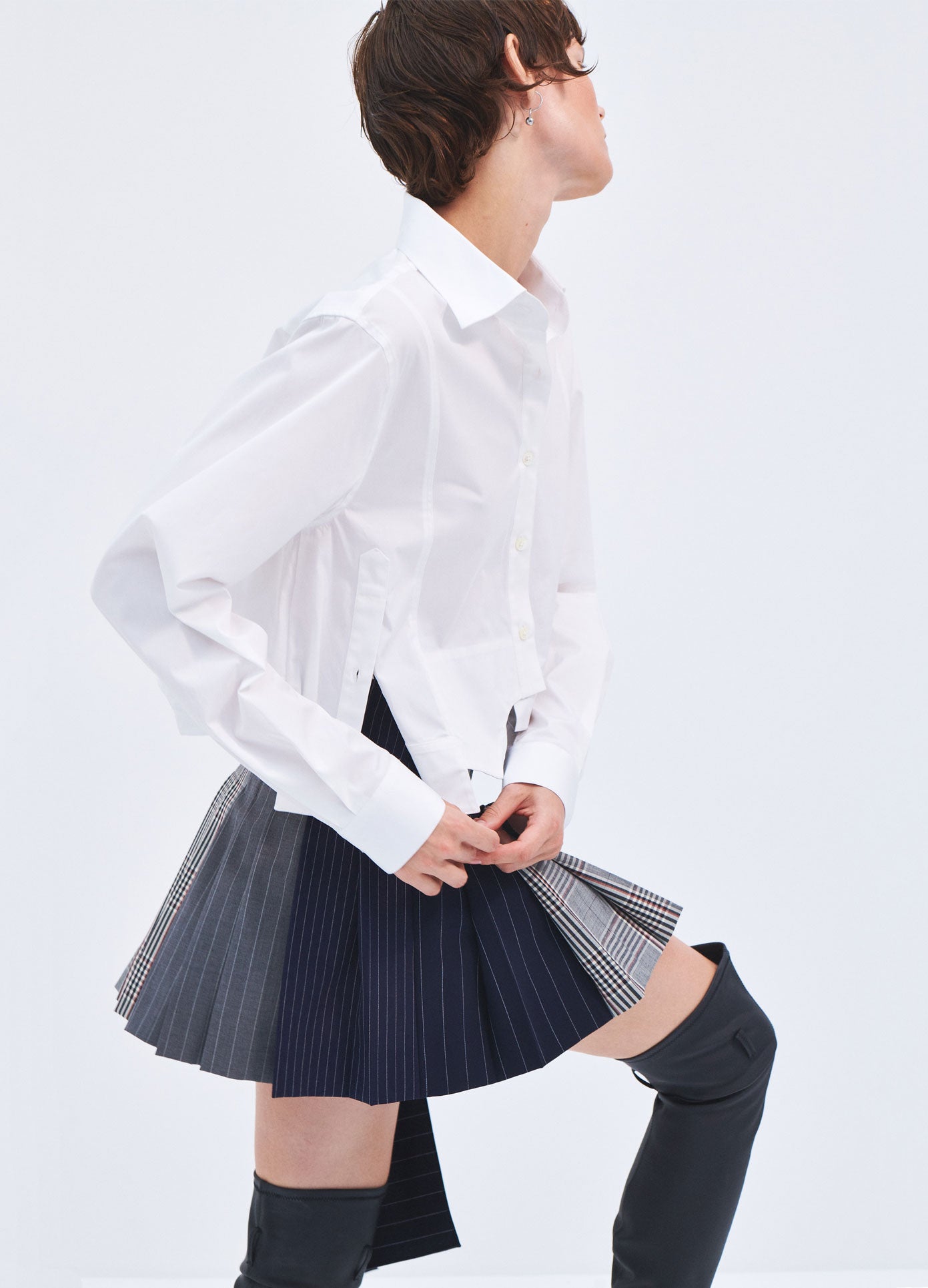 MONSE Spring 2024 Patchwork Pleated Mini Skirt in Black Multi on model side view
