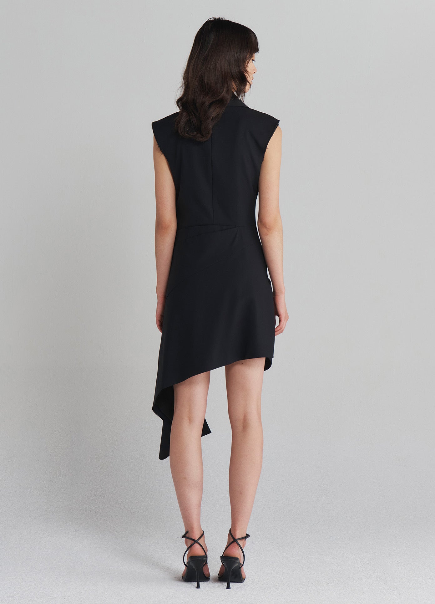 MONSE Tailored Asymmetrical Hem Dress in Black on model full back view