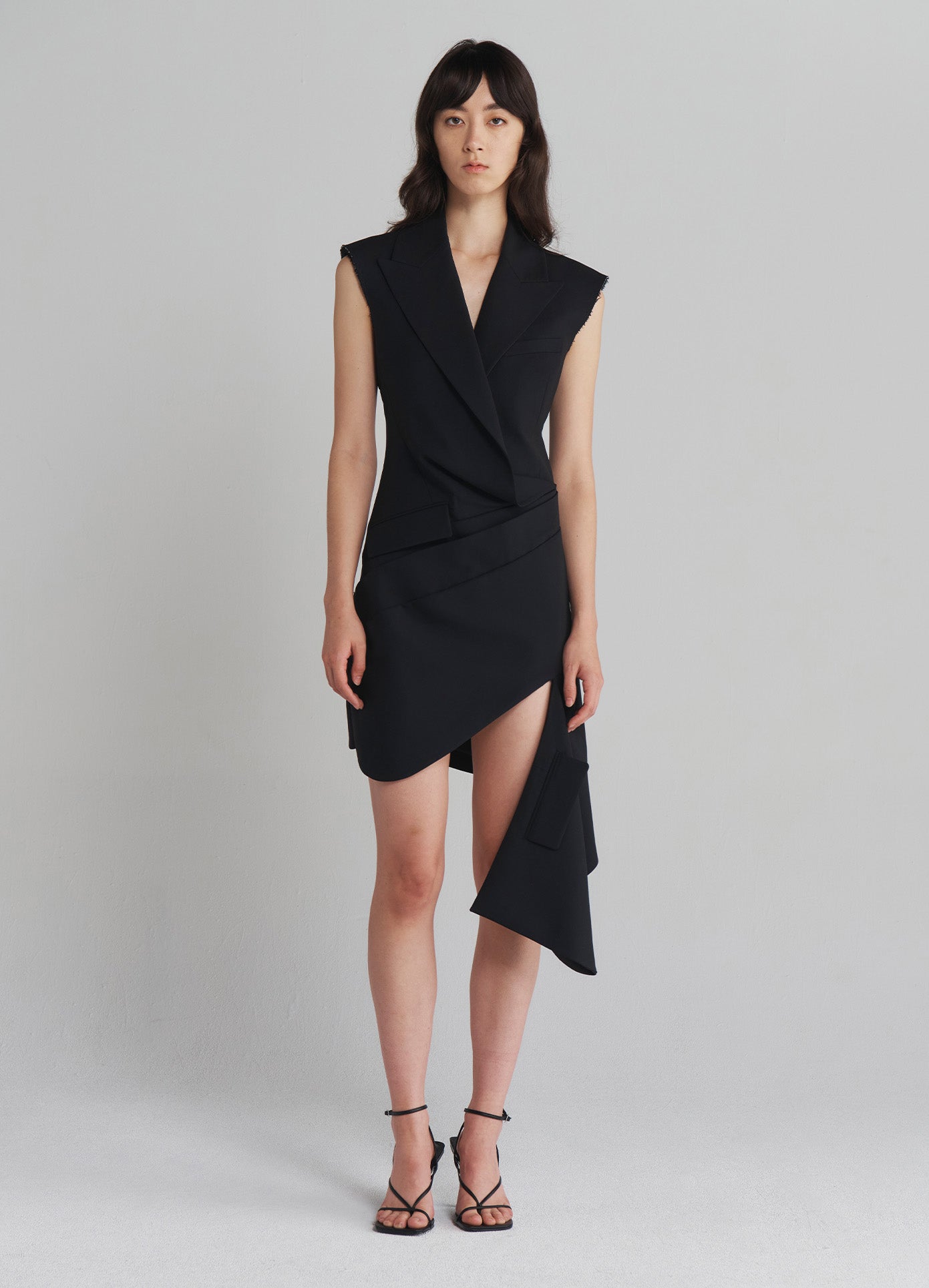 MONSE Tailored Asymmetrical Hem Dress in Black on model full front view