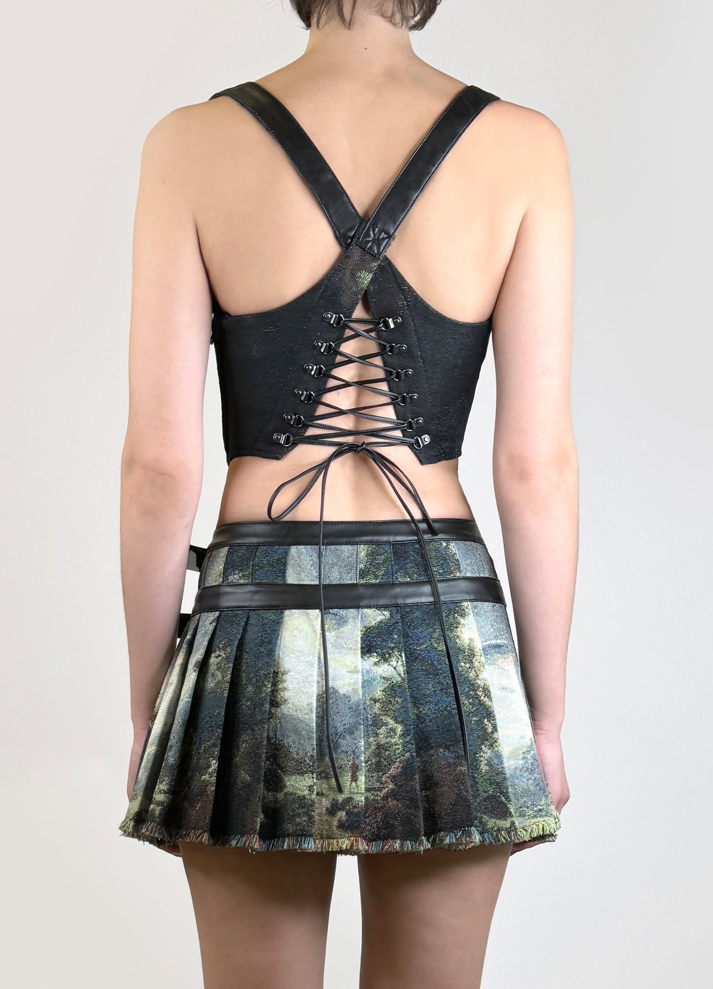 MONSE Tapestry Pleated Combo Mini Skirt in Alien Multi Print on model back view