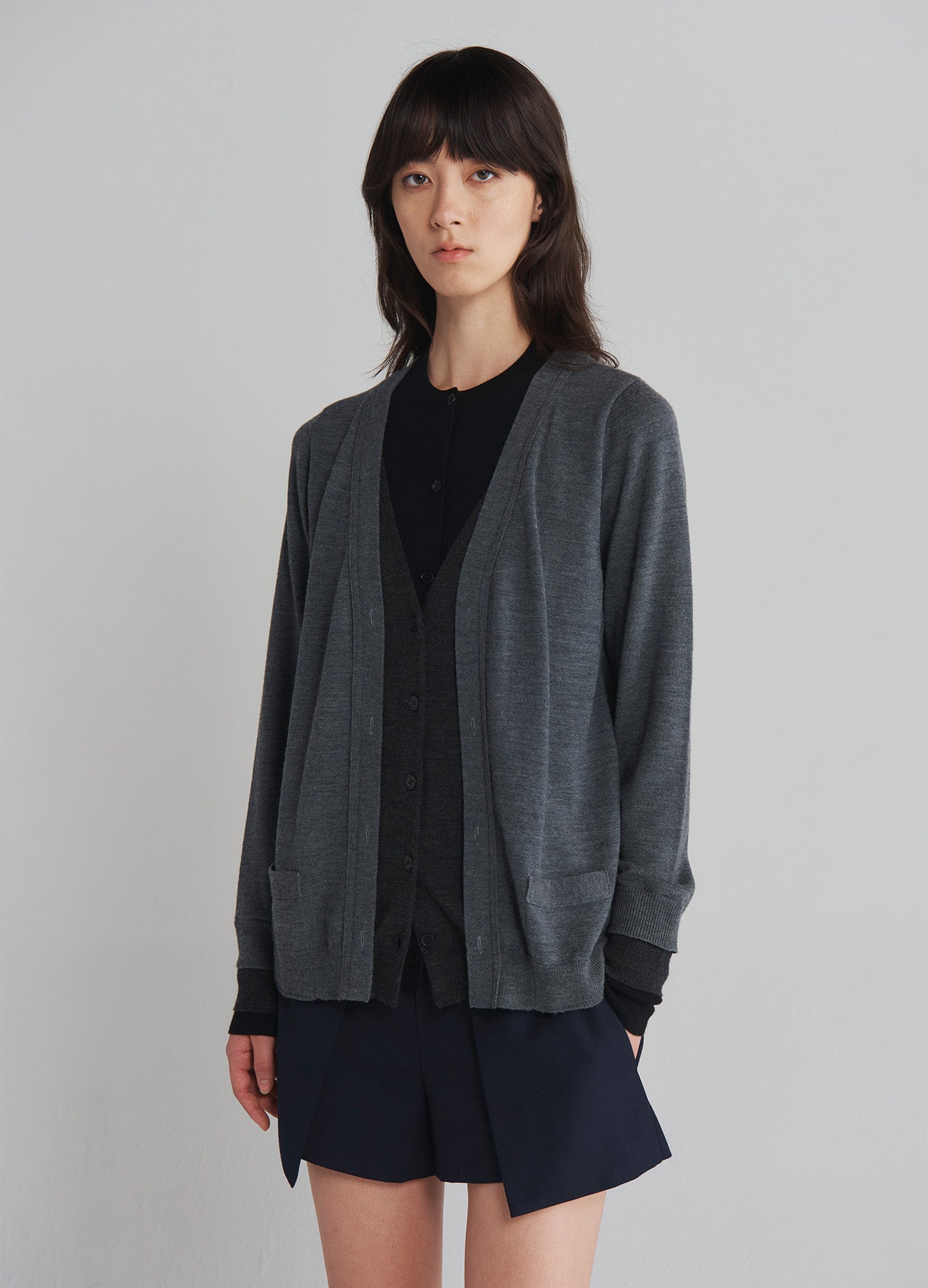 MONSE Triple Layered Cardigan in Black and Grey on model front view