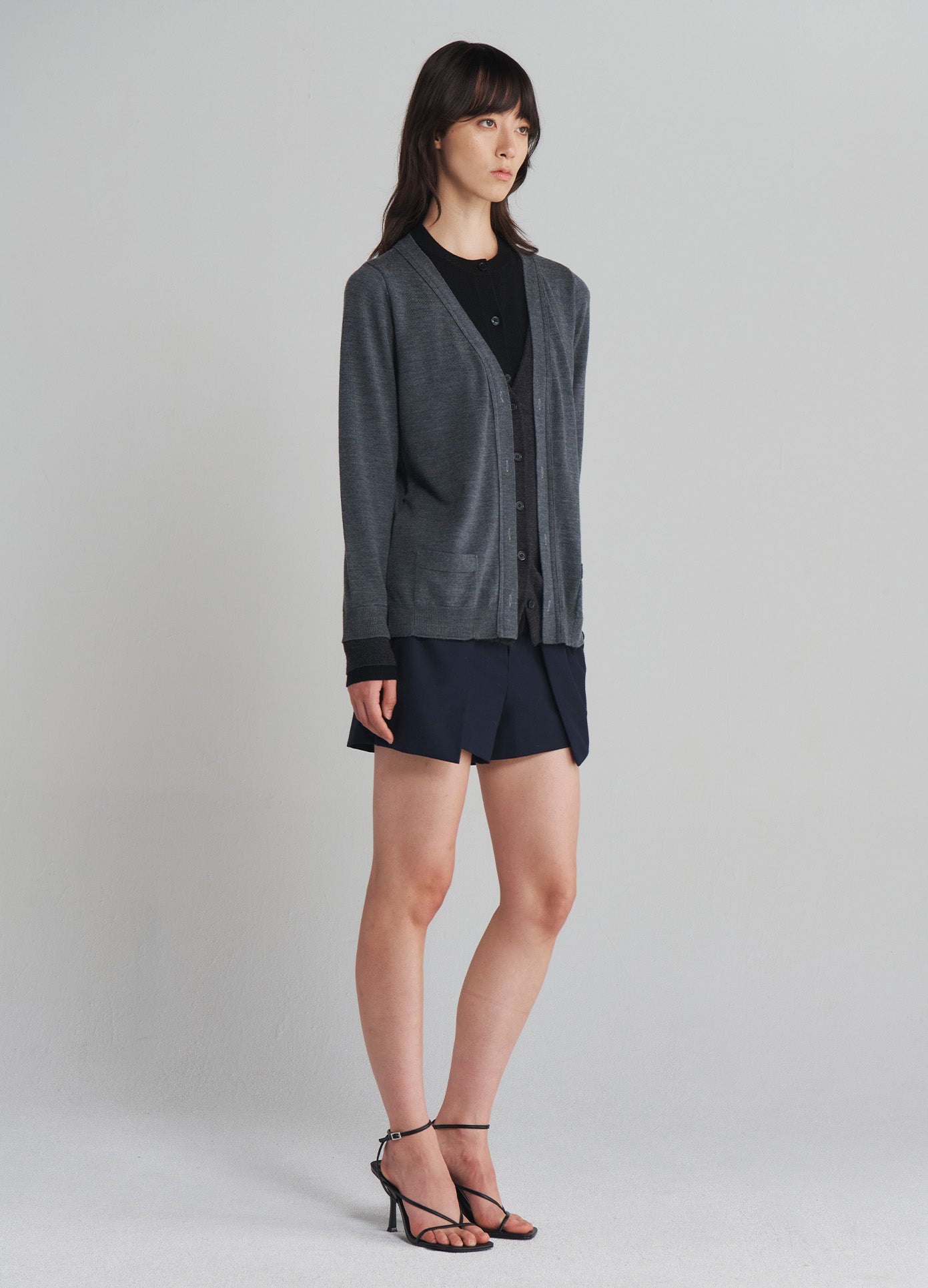 MONSE Triple Layered Cardigan in Black and Grey on model full side view