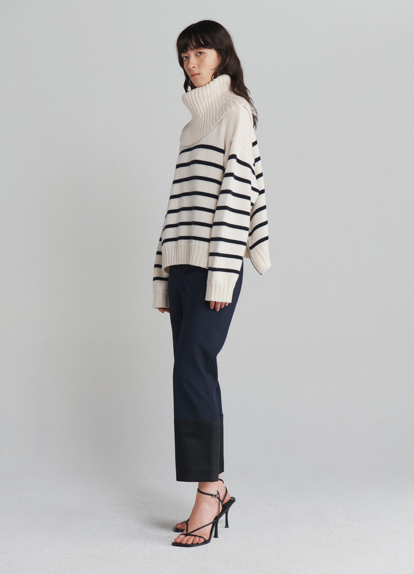 MONSE Turtleneck Striped Sweater in Ivory on model full side view