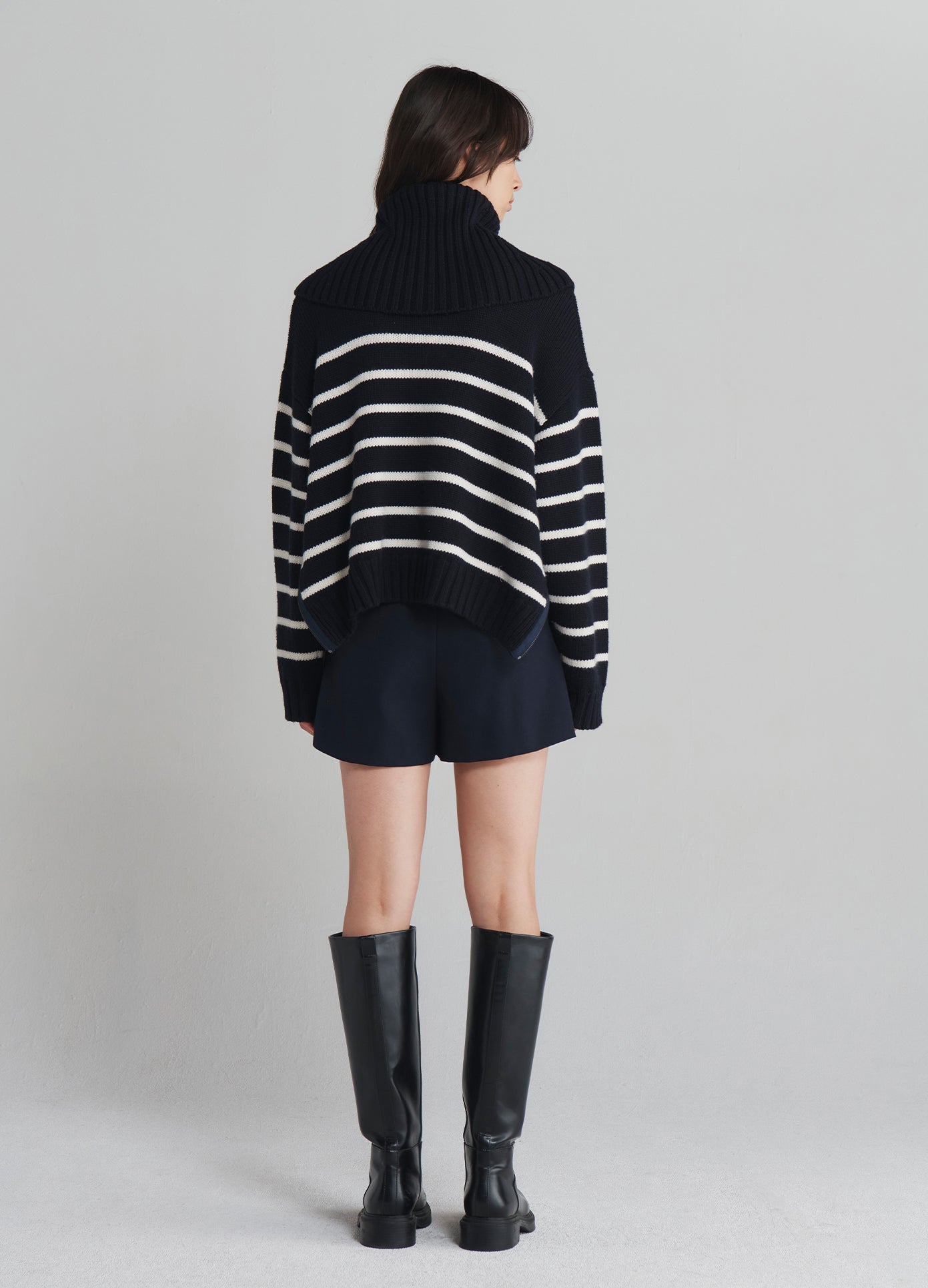 MONSE Turtleneck Striped Sweater in Navy with white stripes on model full back view