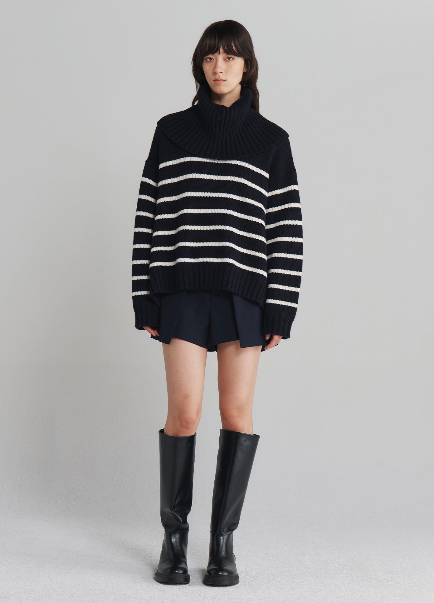 MONSE Turtleneck Striped Sweater in Navy with white stripes on model full front view