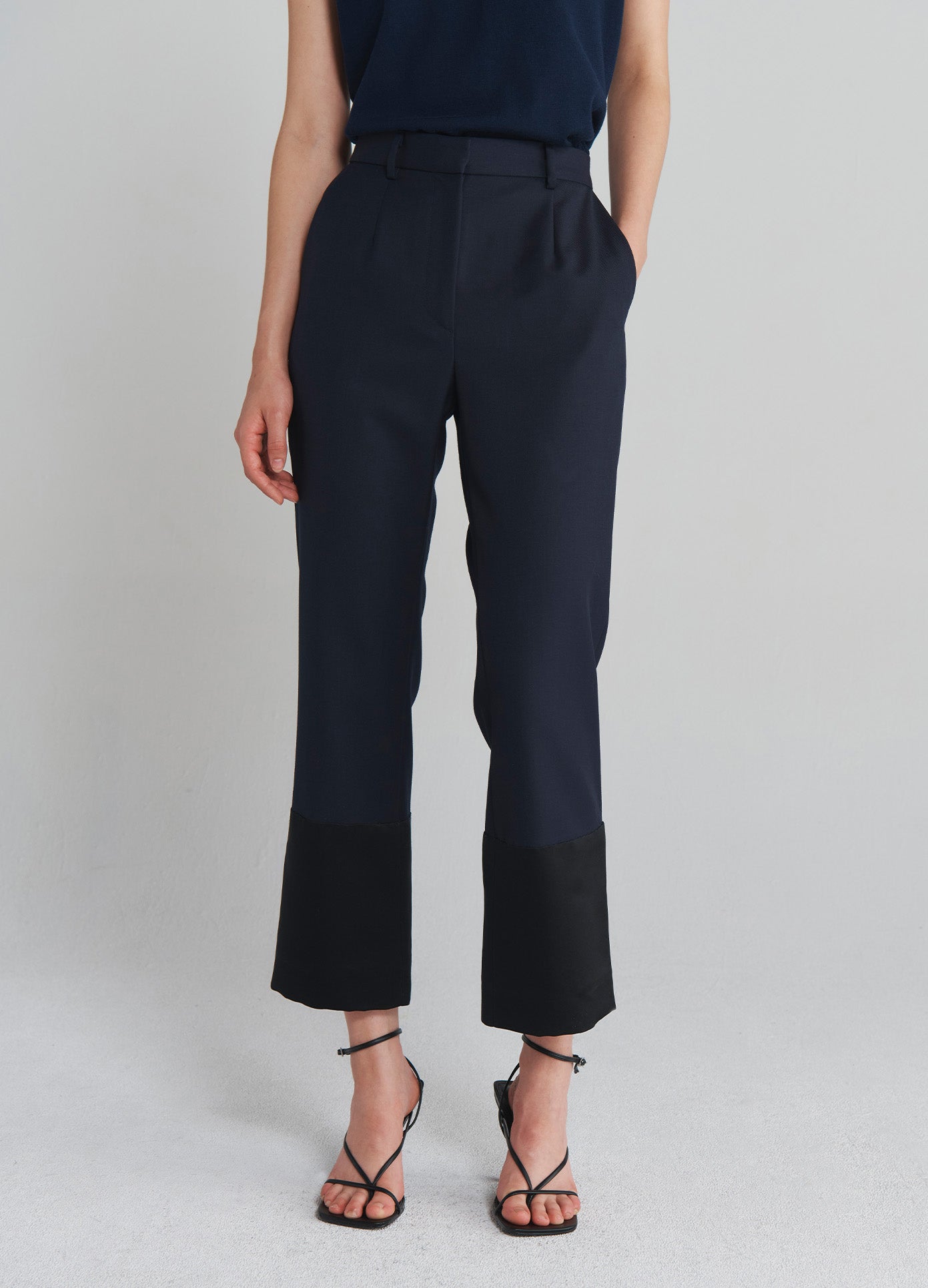 MONSE Tuxedo Cuff Trousers in Navy on model front bottom view