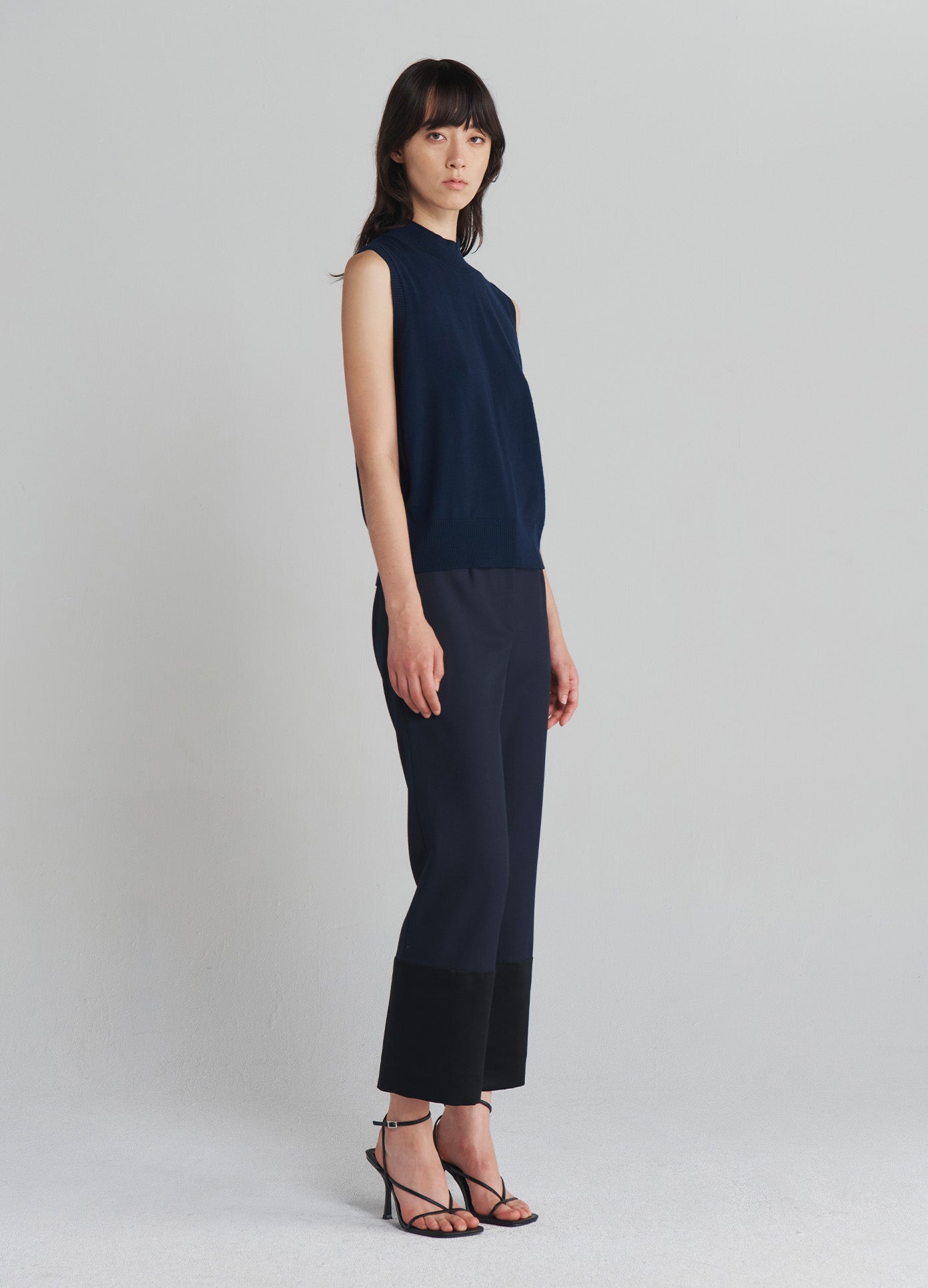 MONSE Tuxedo Cuff Trousers in Navy on model full side view