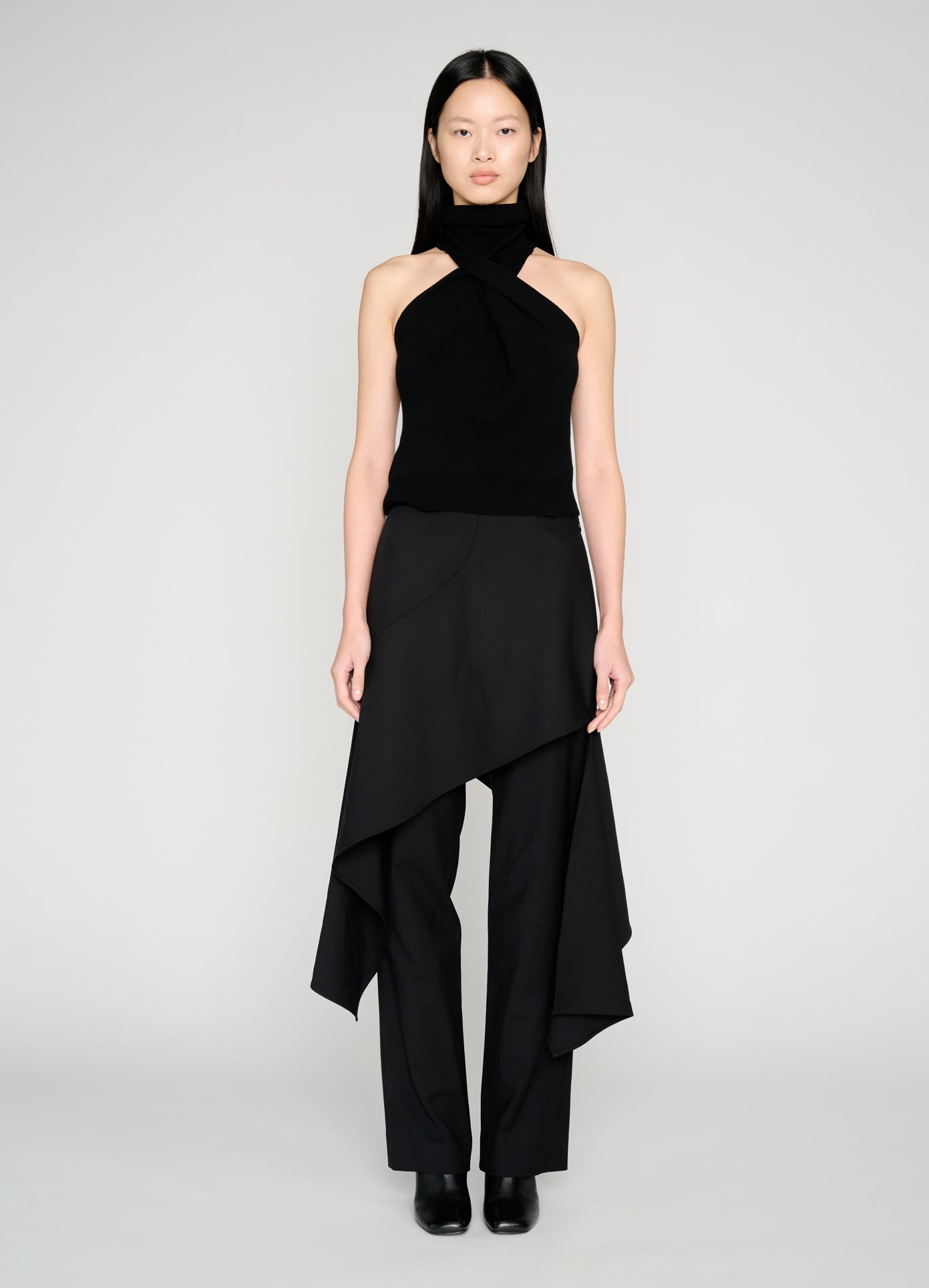 MONSE Twist Front Roll Neck Knit Top in black on model full front view