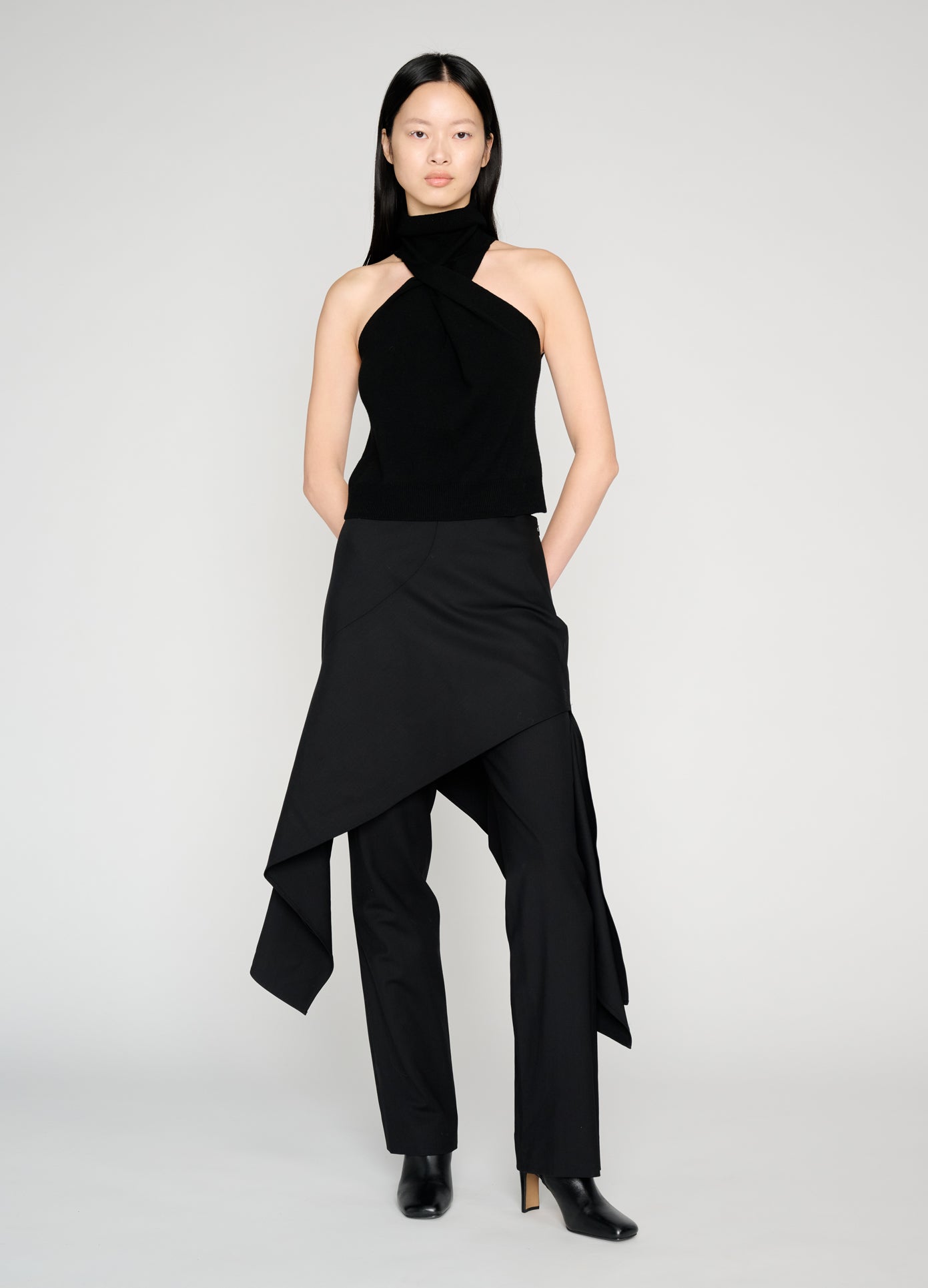 MONSE Twist Front Roll Neck Knit Top in black on model style full front view