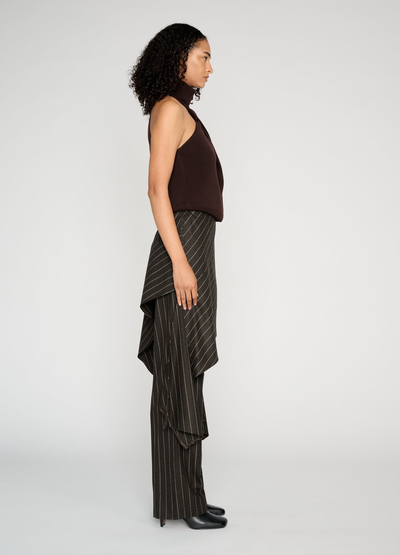 MONSE Twist Front Roll Neck Knit Top in brown on model full side view