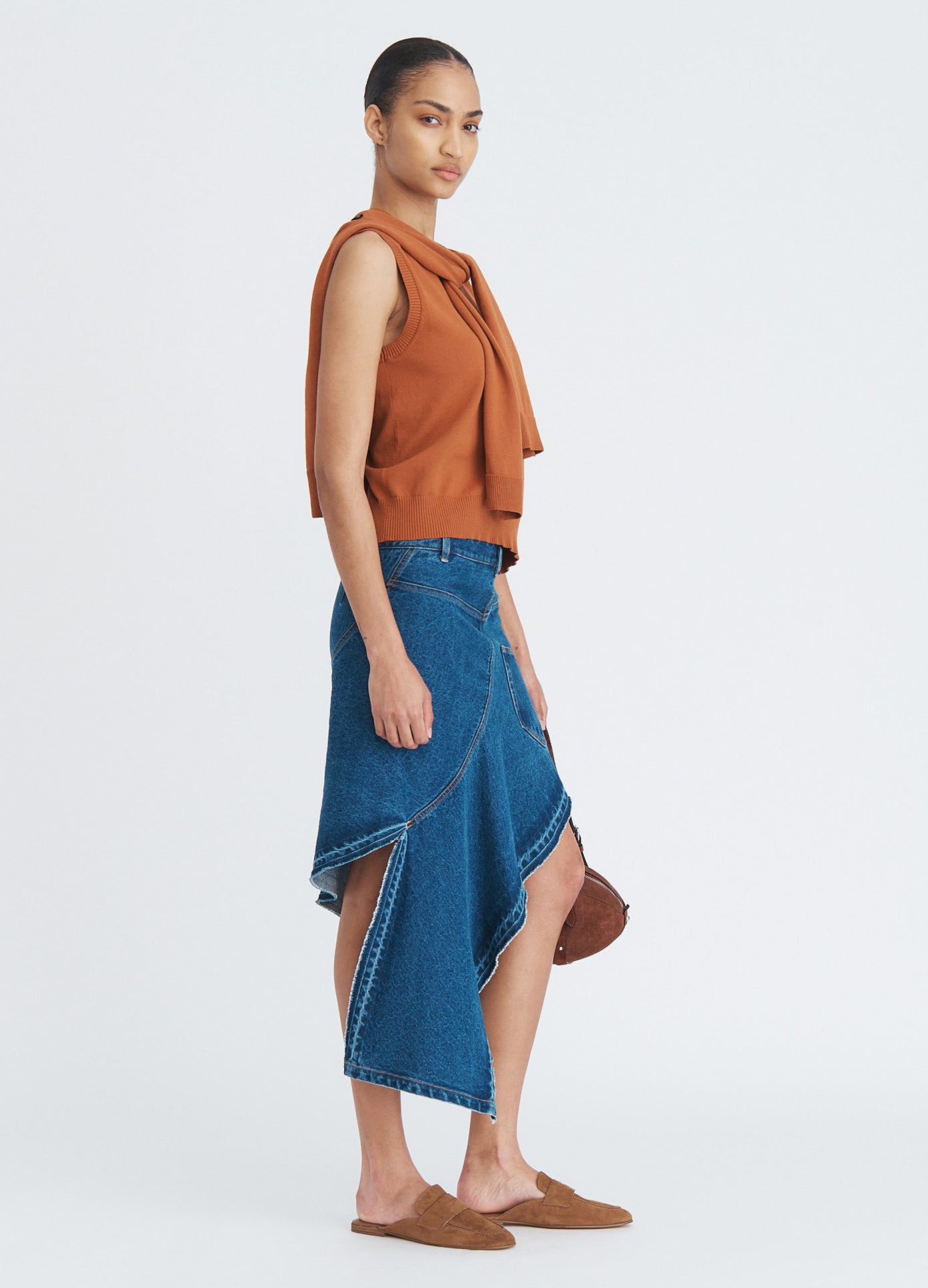 MONSE Twisted Denim Skirt in indigo on model full side view