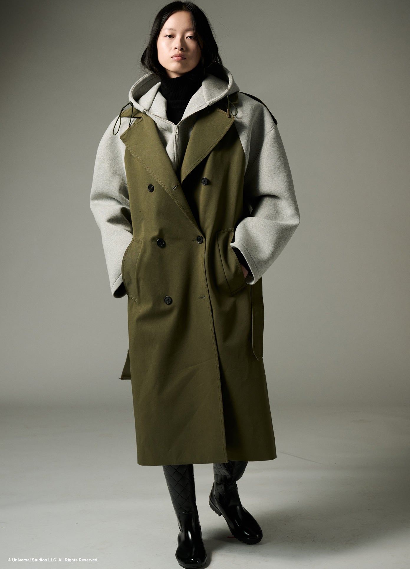 MONSE x Wicked Collaboration Oversized Emerald Hooded Trench in olive and grey on model walking full front view