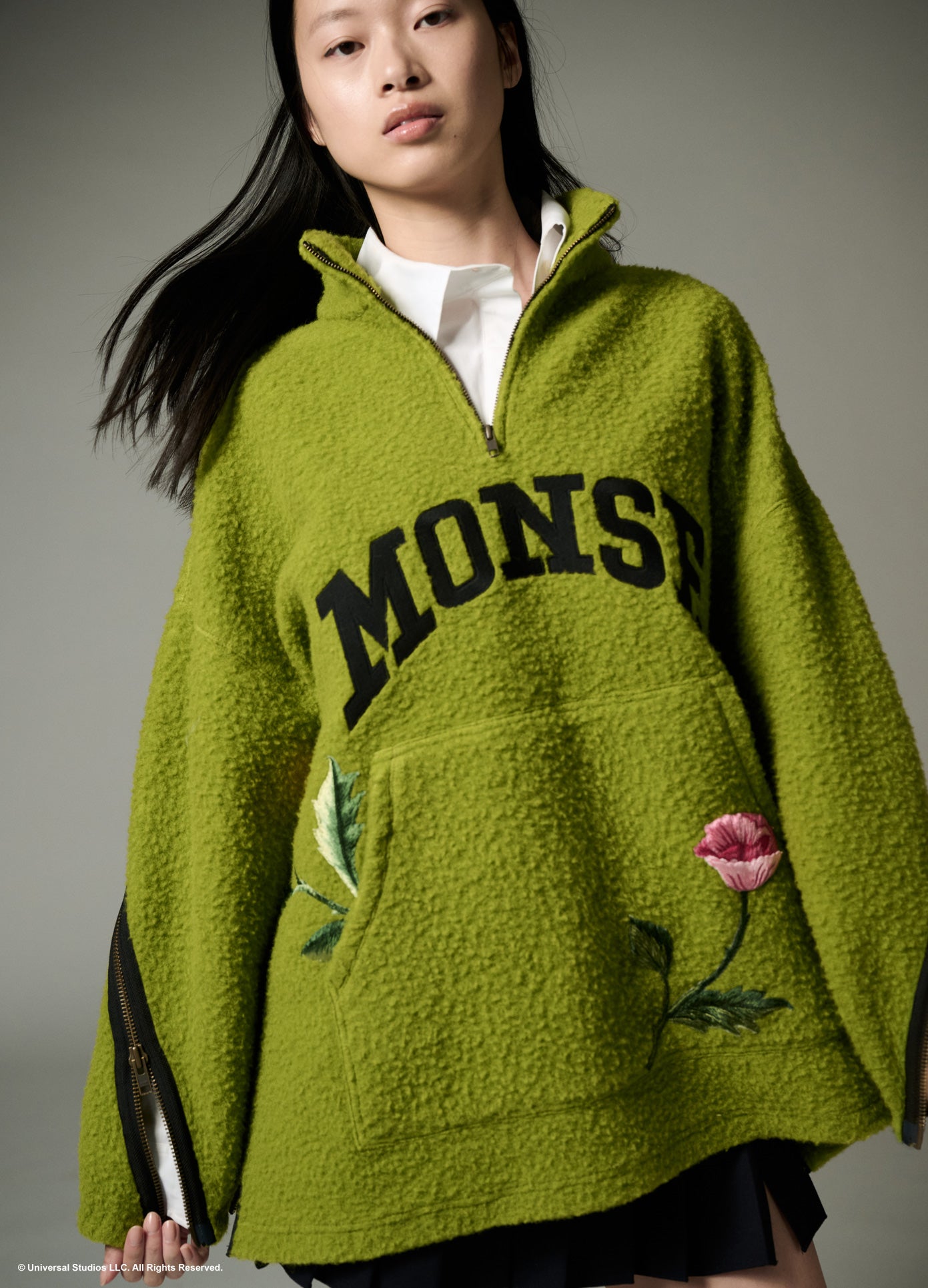 MONSE x Wicked Collaboration Oz Varsity Fleece in green on model front view