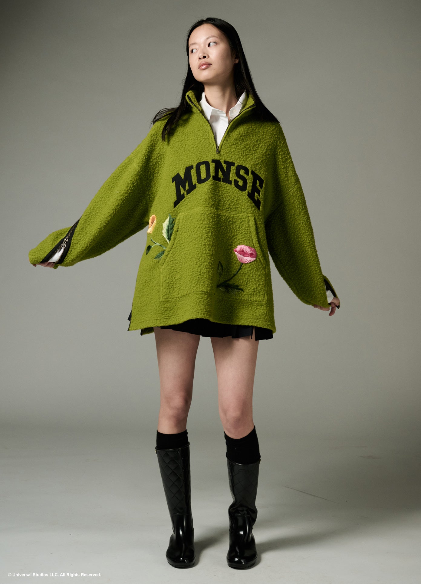 MONSE x Wicked Collaboration Oz Varsity Fleece in green on model looking right full front view