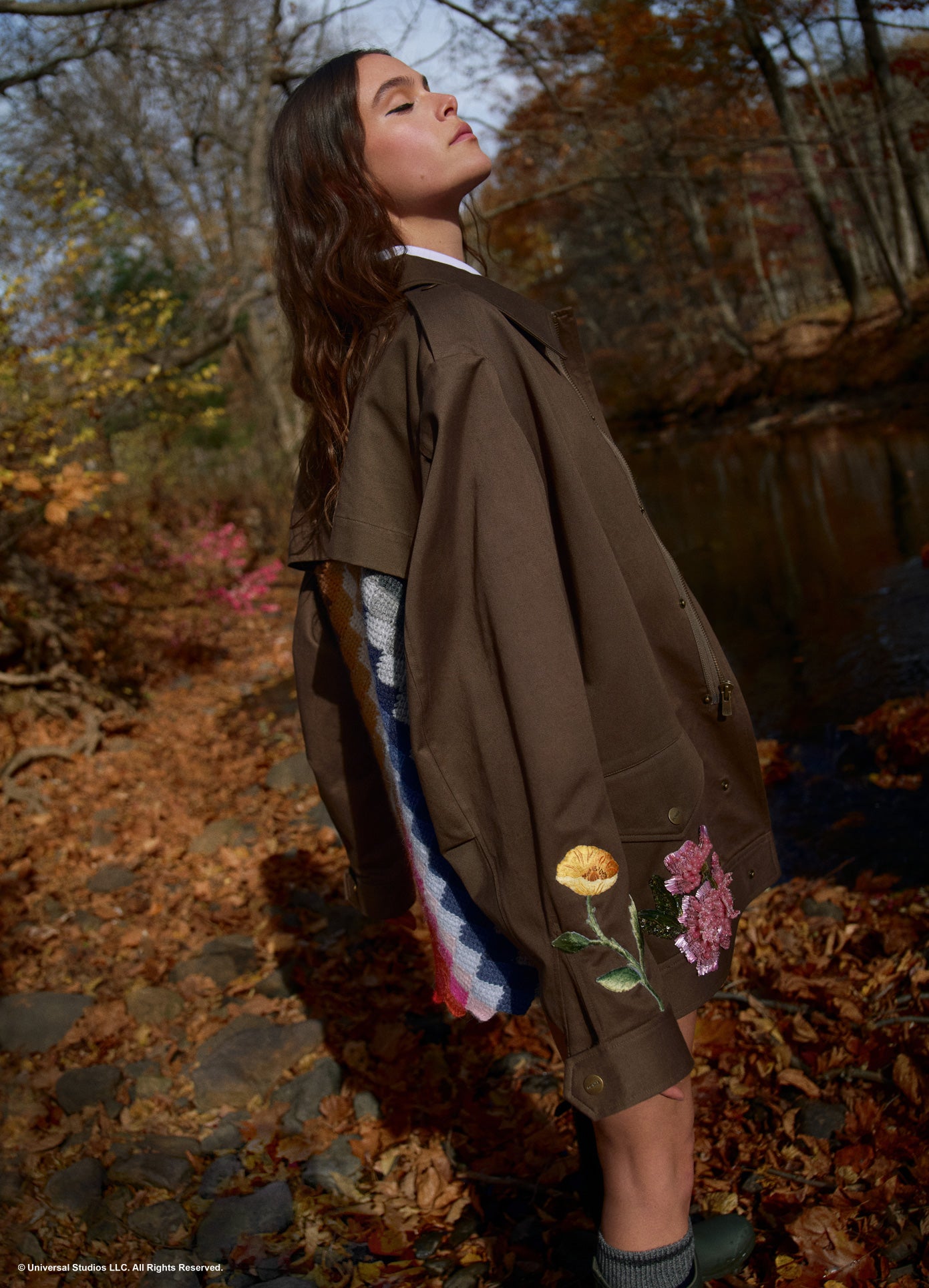 MONSE x Wicked Collaboration The Alchemy Jacket in olive on model standing in creek full side view