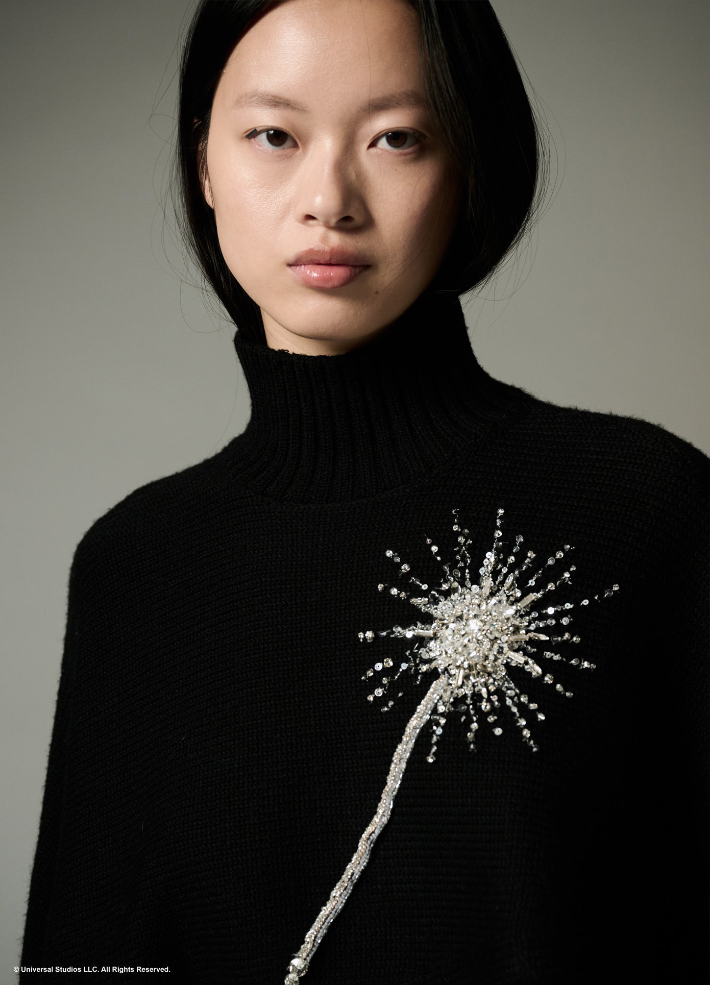 MONSE x Wicked Collaboration The Charmed Sweater in black on model zoomed in front view