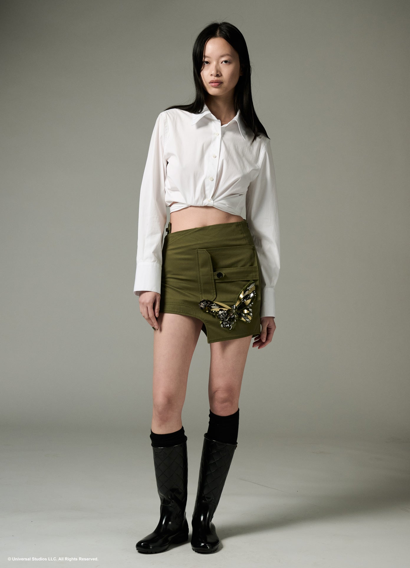 MONSE x Wicked Collaboration The Monarch Skirt in olive on model full front view