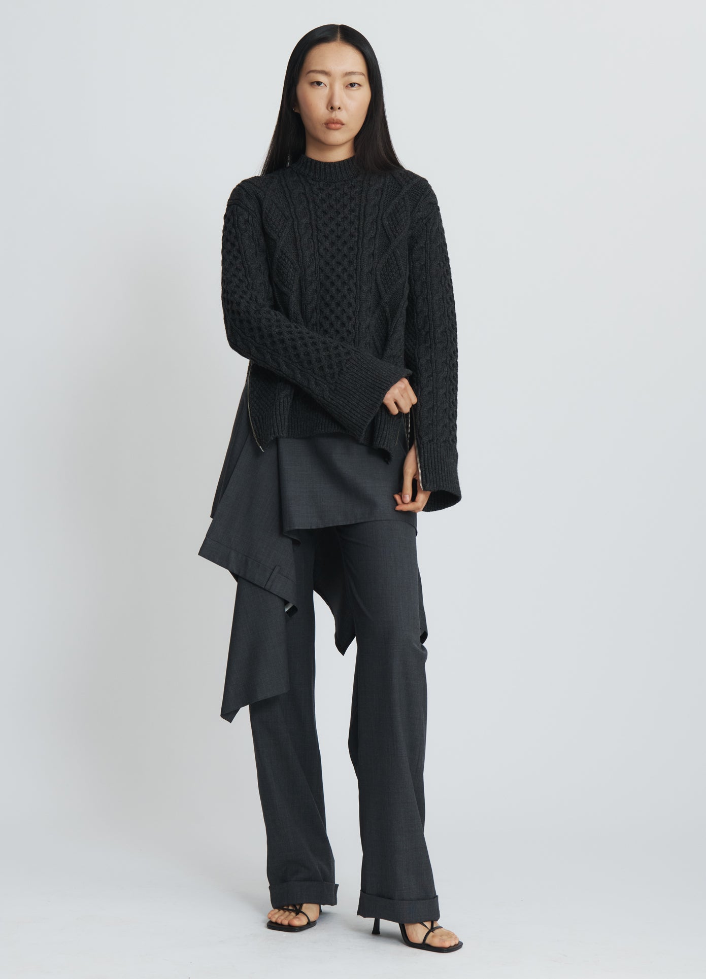 MONSE Zipper Oversized Sweater in charcoal on model touching arm full front view