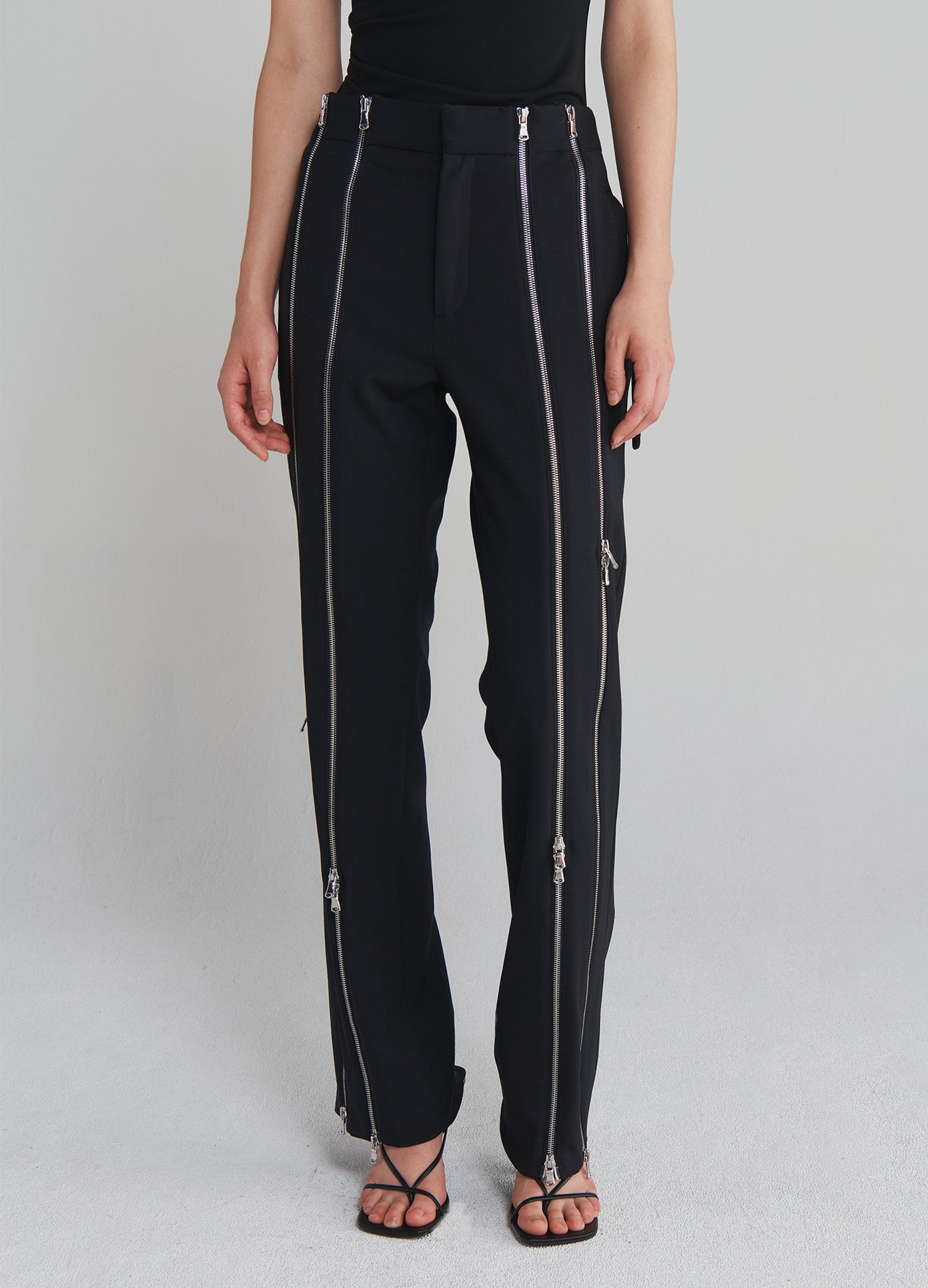 MONSE Zippered Tailored Trousers in Black on model front bottom view