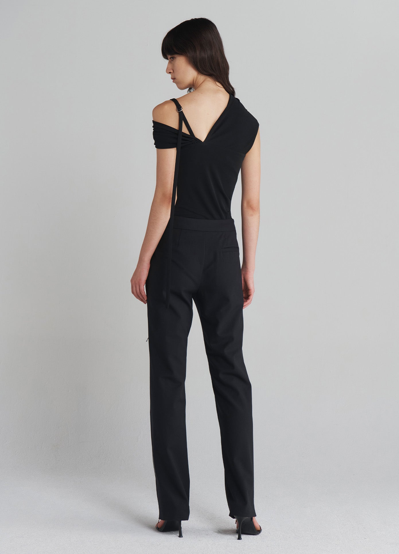 MONSE Zippered Tailored Trousers in Black on model full back view