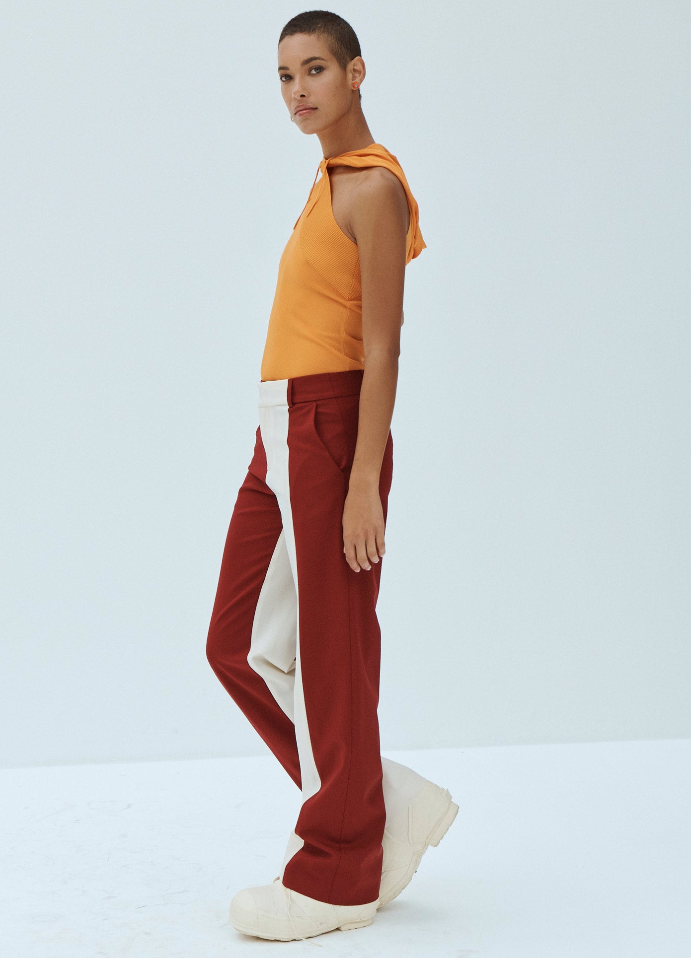 MONSE Asymmetrical Knit Hoodie in Orange on Model Side View