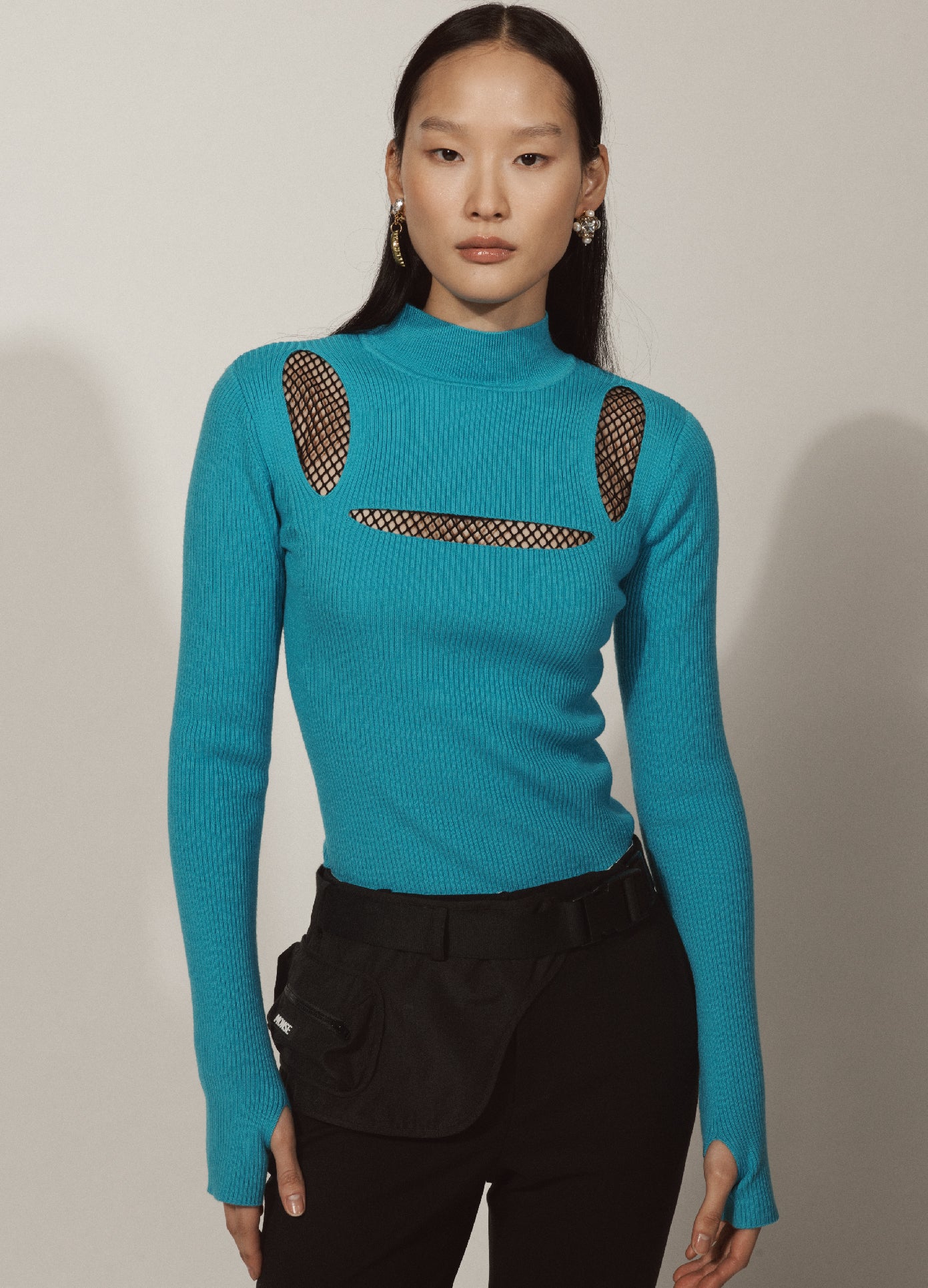 MONSE Pouch in Black on Asian Model Front View