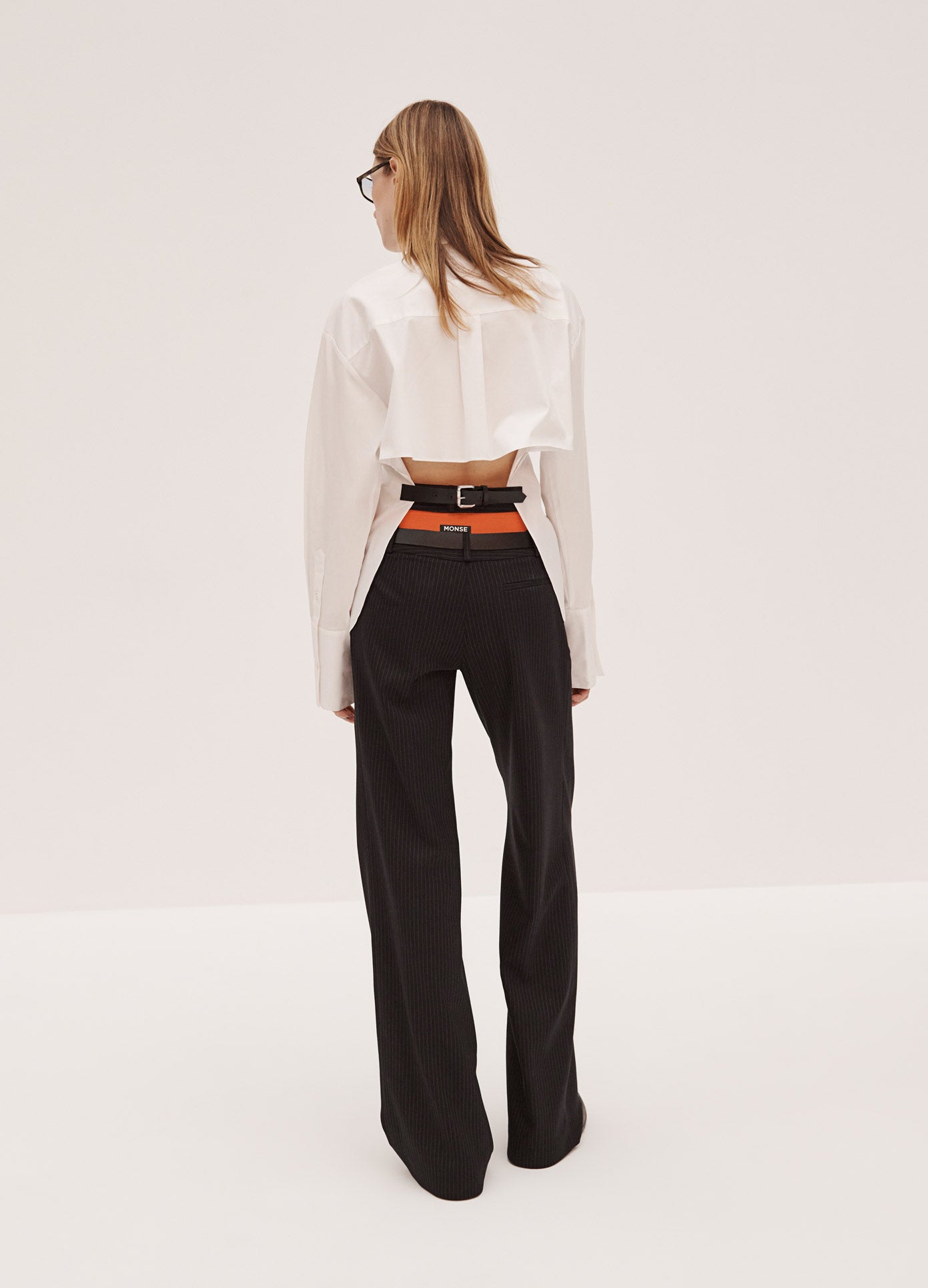 MONSE Belted Back Shirt in White on Model Full Back View