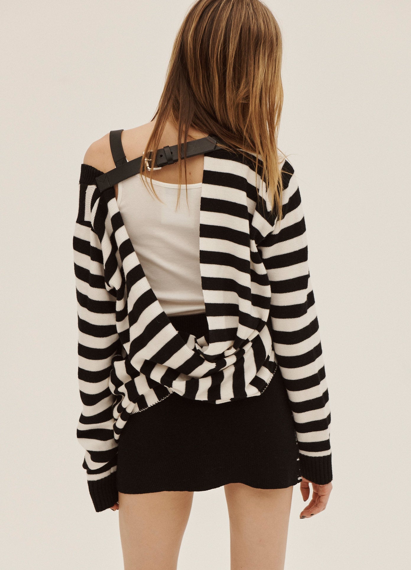 MONSE Belted Tank Top in White on Model Wearing Sweater Back View