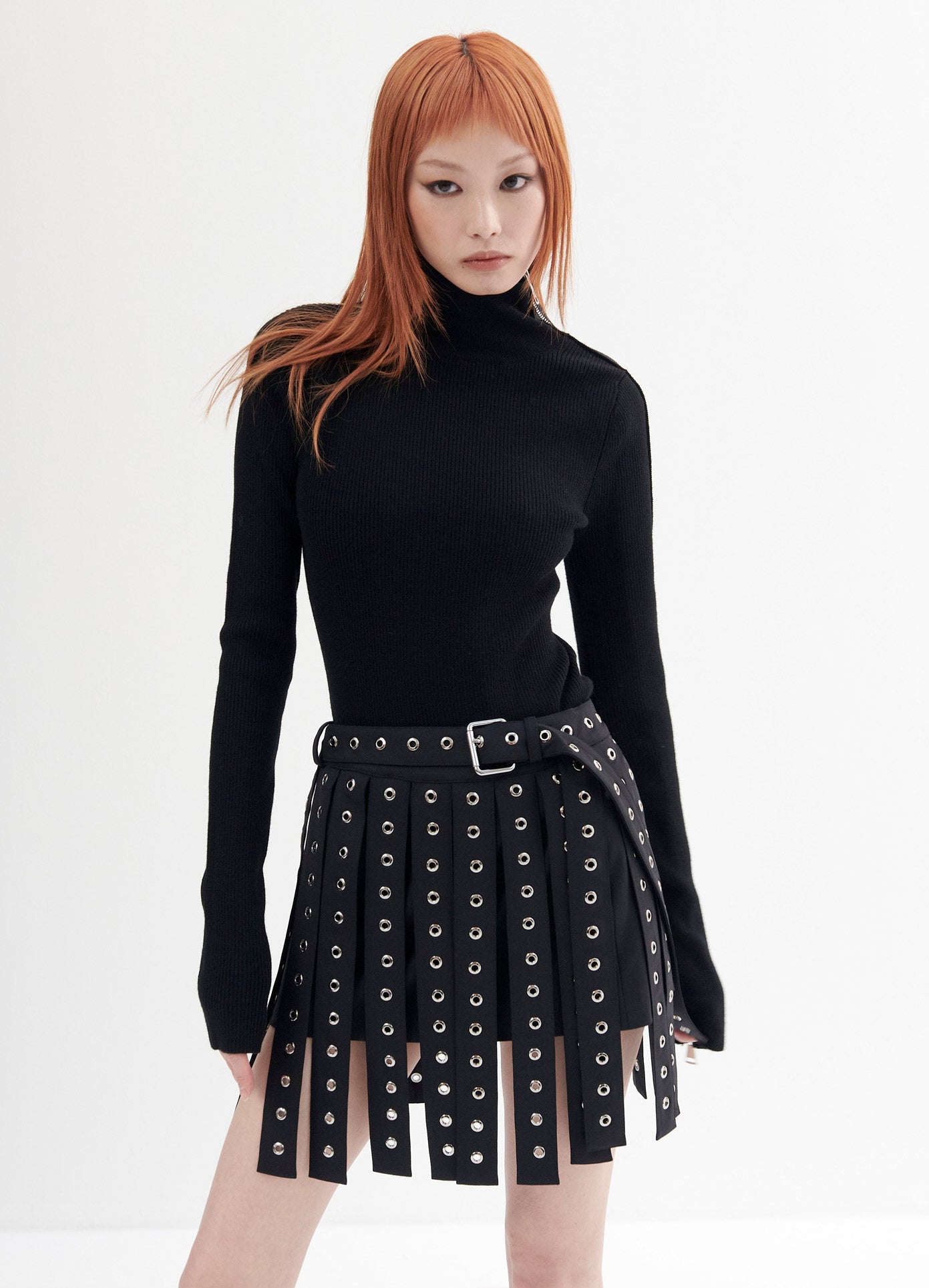 MONSE Car Wash Grommet Mini Skirt in Black on Model Front View