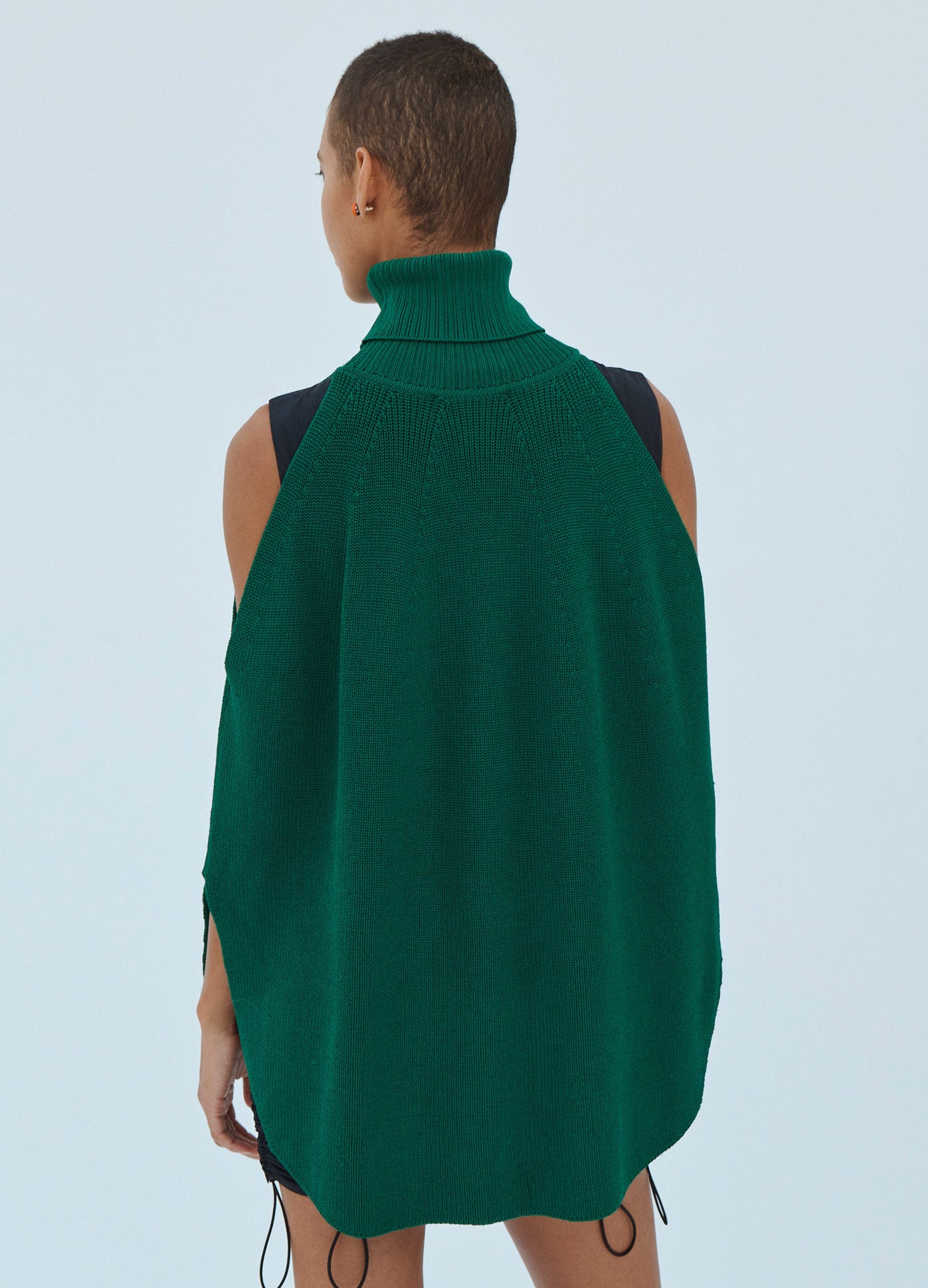MONSE Cold Shoulder Turtleneck Sweater in Green on Model Back View