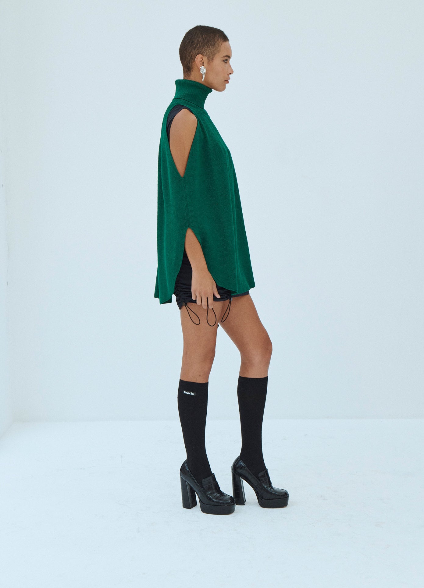 MONSE Cold Shoulder Turtleneck Sweater in Green on Model Side View