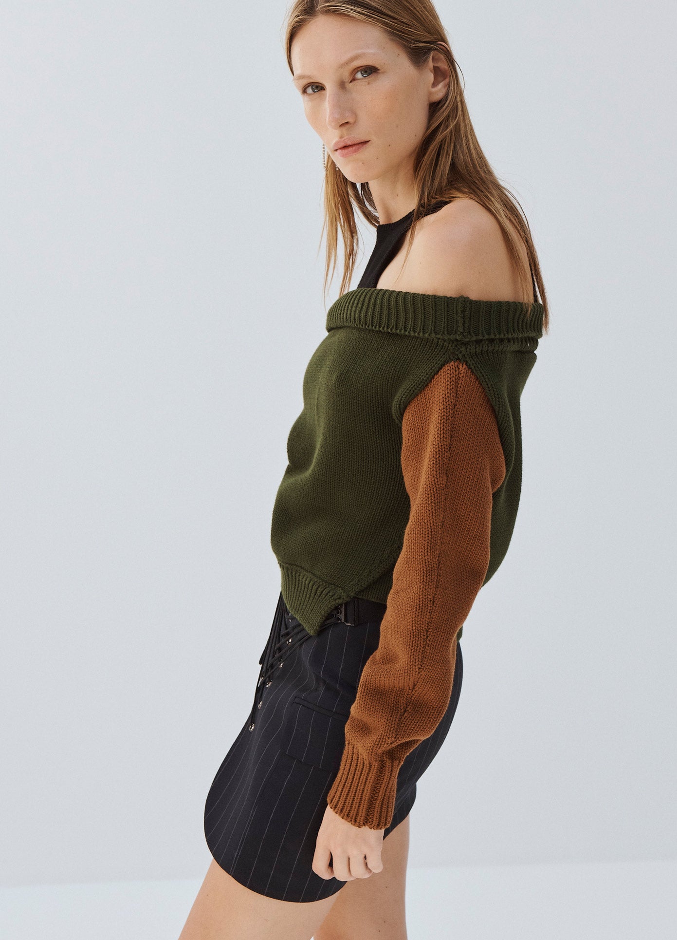 MONSE Color Blocked Off Shoulder Sweater in Olive on Model Side View