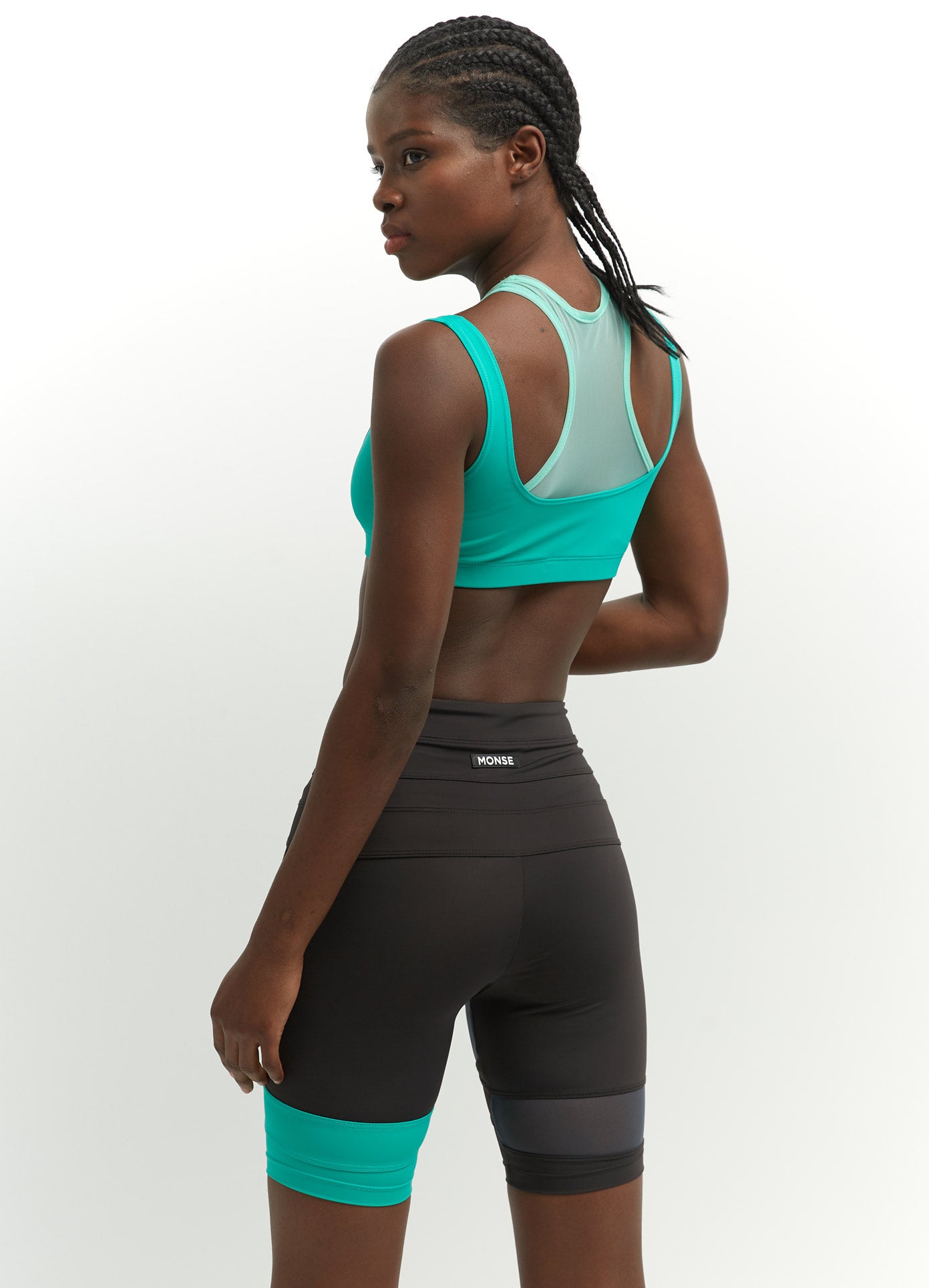MONSE Criss Cross Bike Shorts in Mokaccino and Turquoise on Model Back View