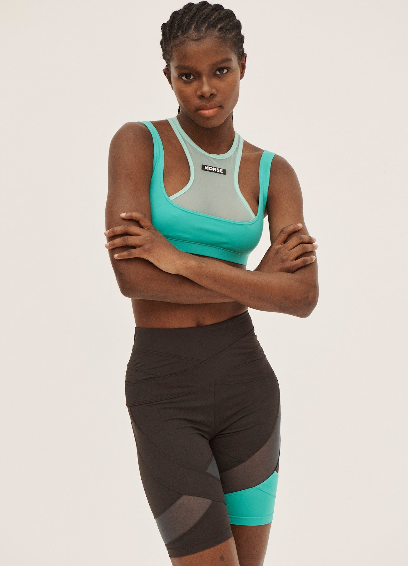 MONSE Criss Cross Bike Shorts in Mokaccino and Turquoise on Model Front View