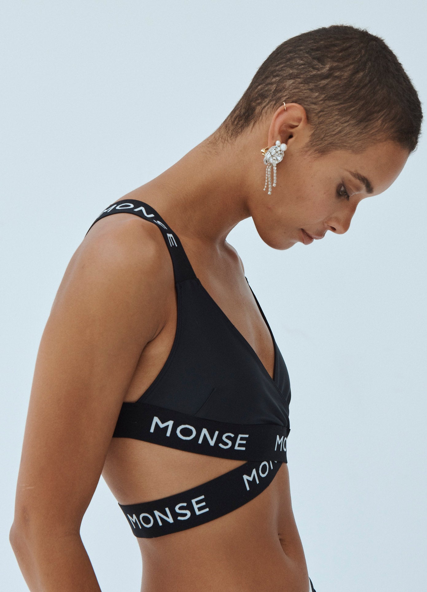 MONSE Criss Cross Sports Bra Top in Black on Model Side View