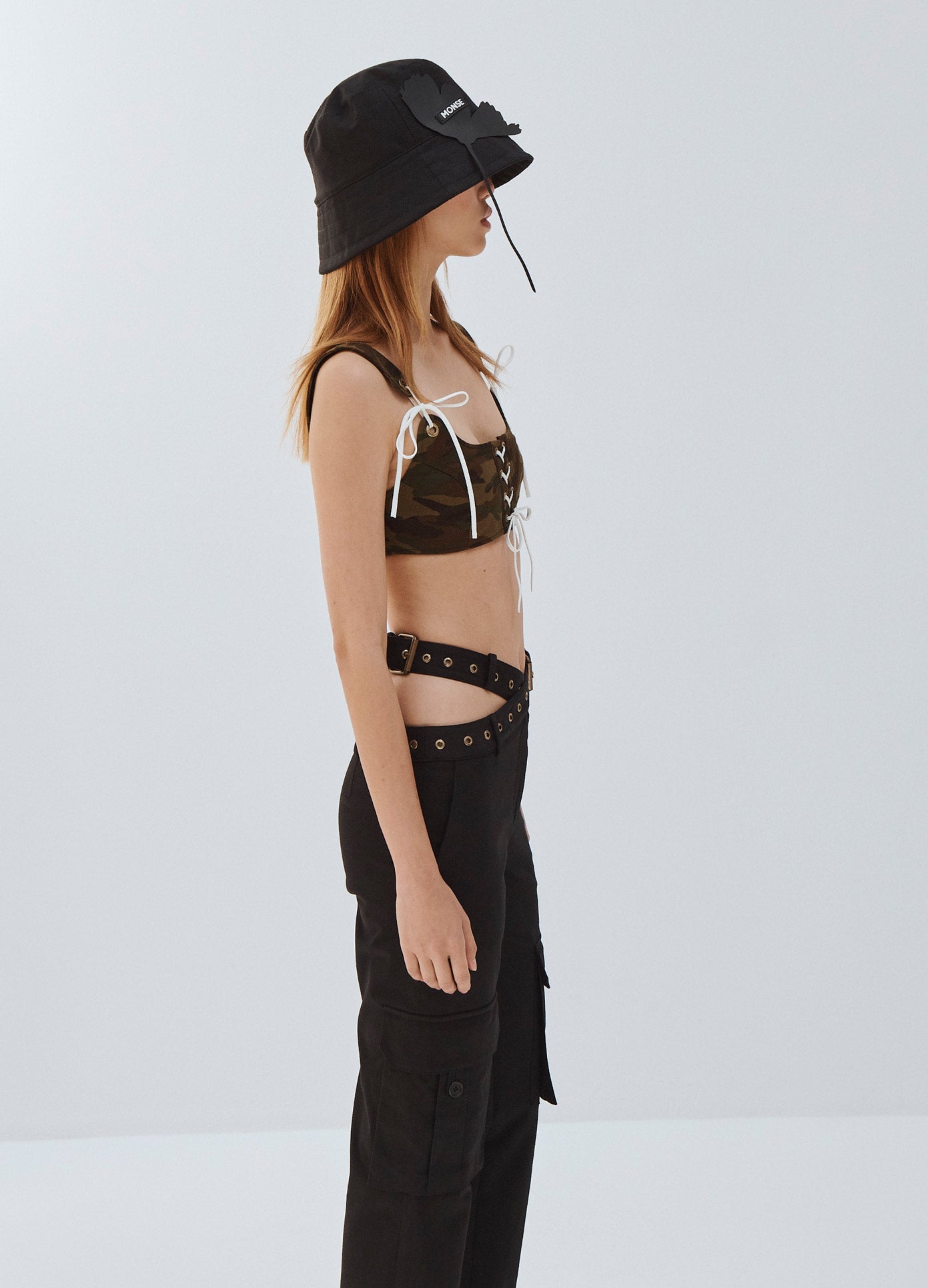 MONSE Criss Cross Waistband Cargo Pocket Pants in Black on Model Full Side View