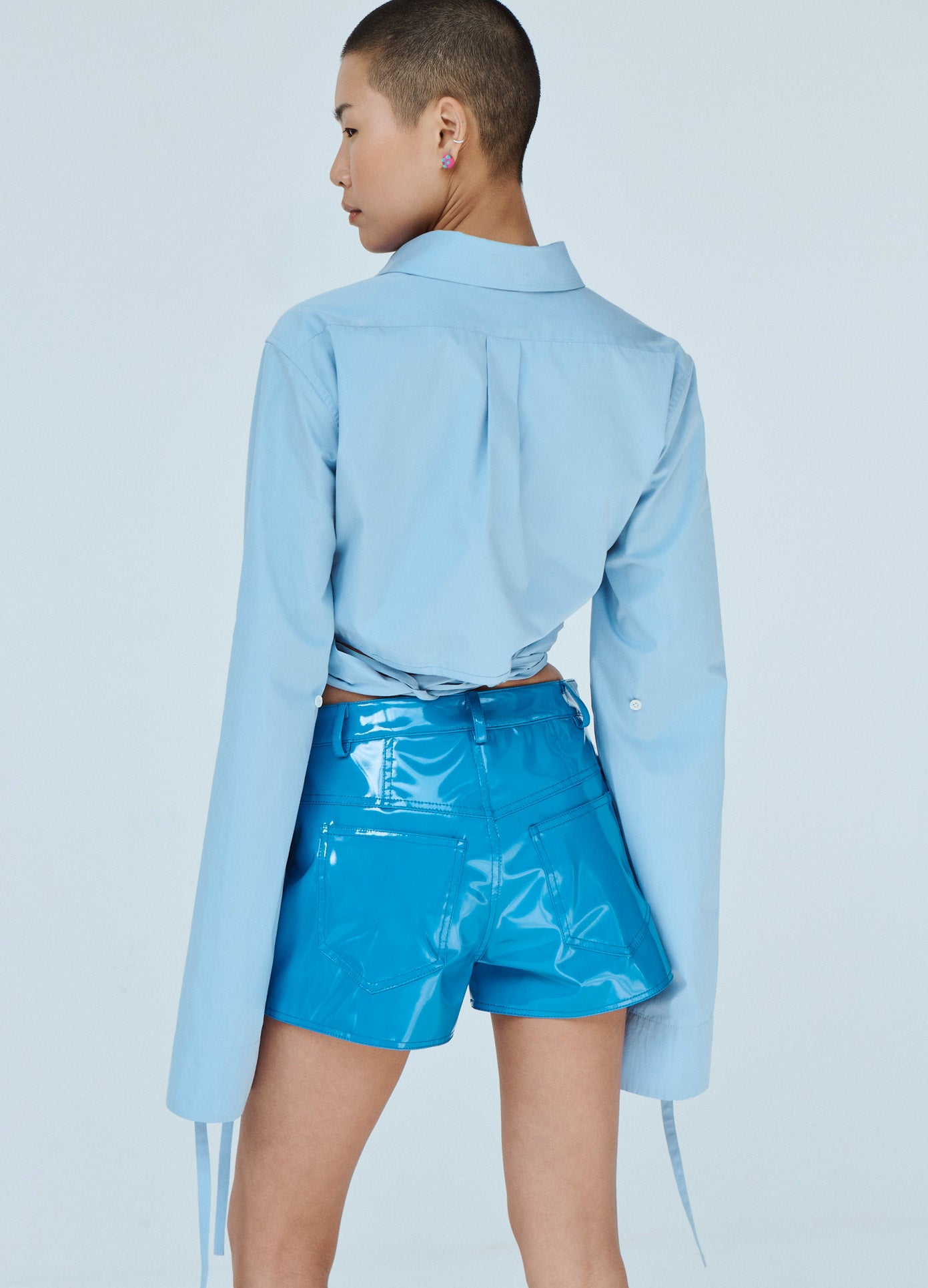 MONSE Cropped X Long Sleeve Shirt in Blue on Model Back Detail View