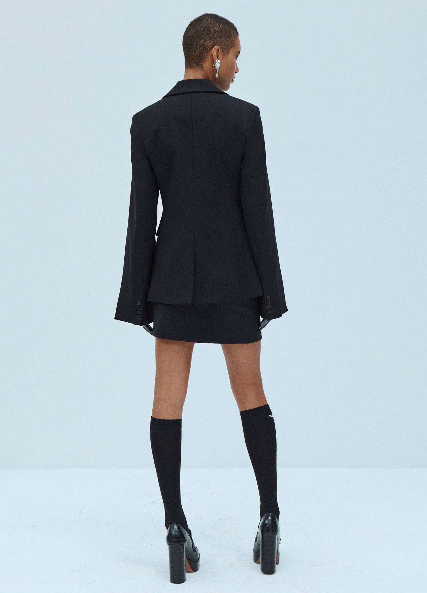 MONSE Deconstructed Detail Mini Skirt in Black on Model Back View