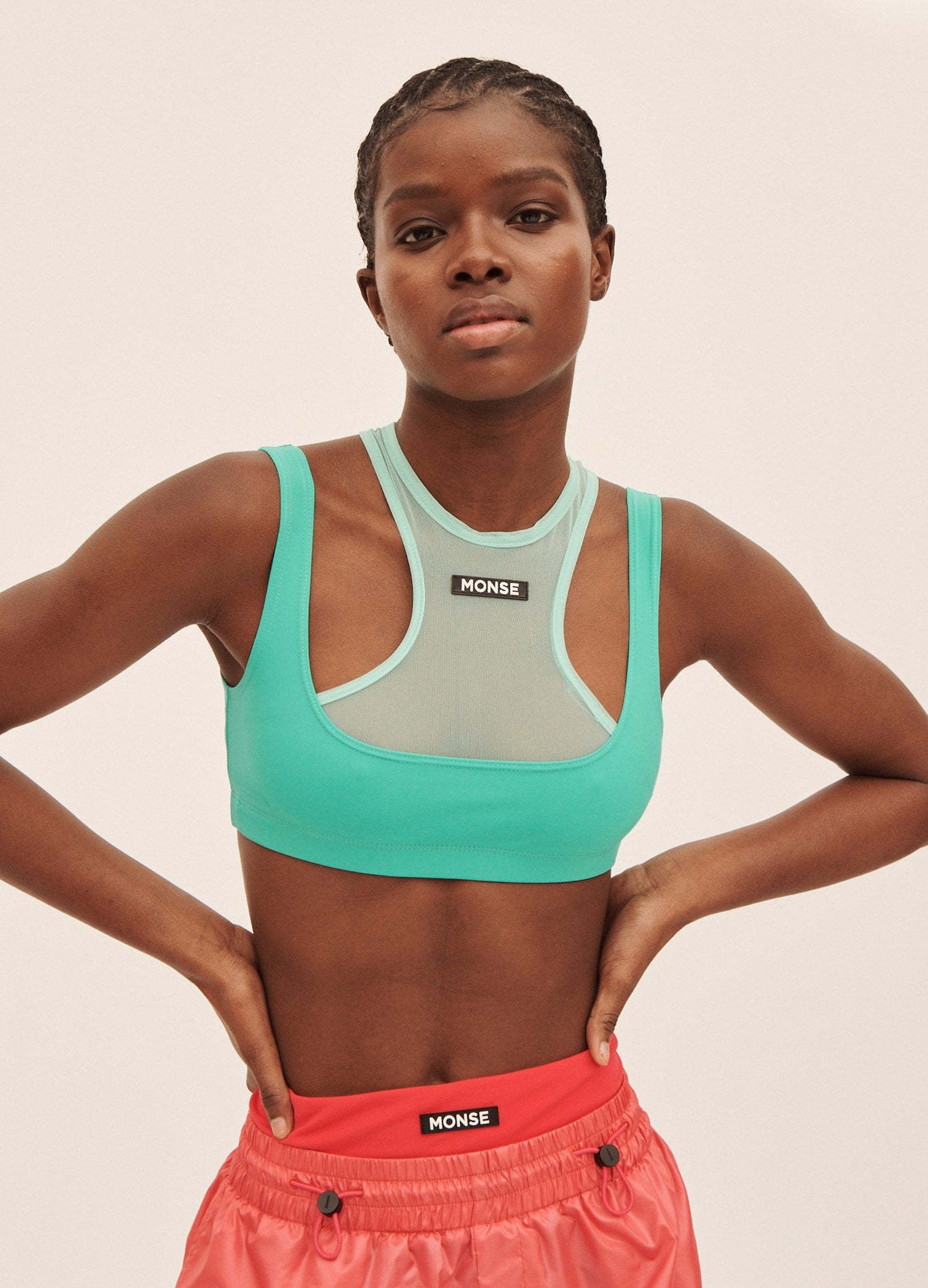 MONSE Double Layered Sports Bra in Turquoise on Model Front Detail View