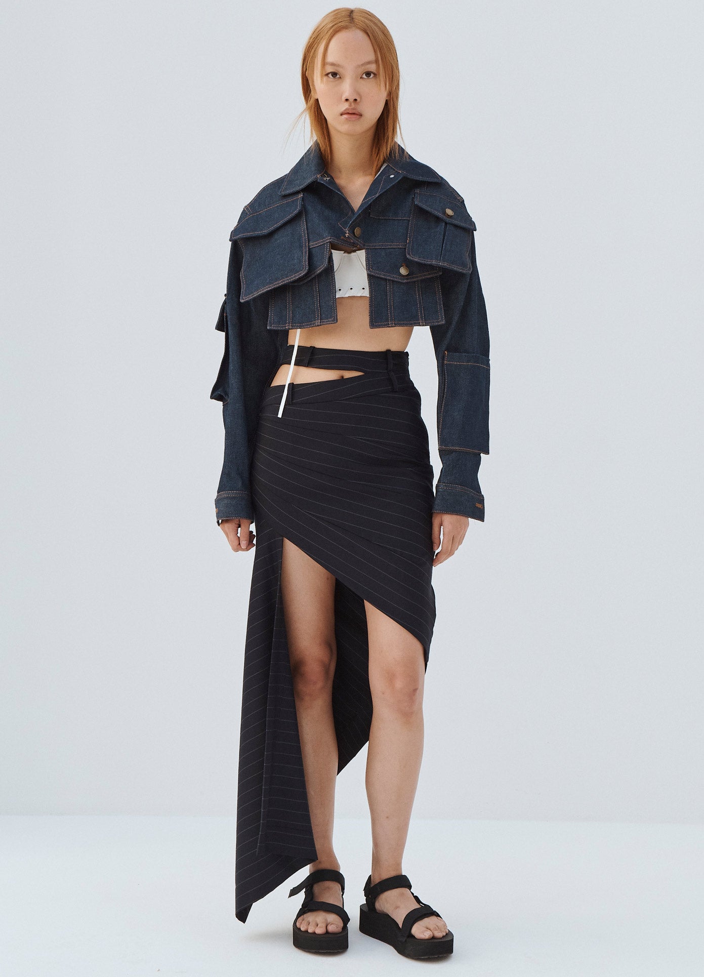 MONSE Double Waistband Asymmetrical Skirt in Midnight on Model Wearing Denim Jacket Full Front View