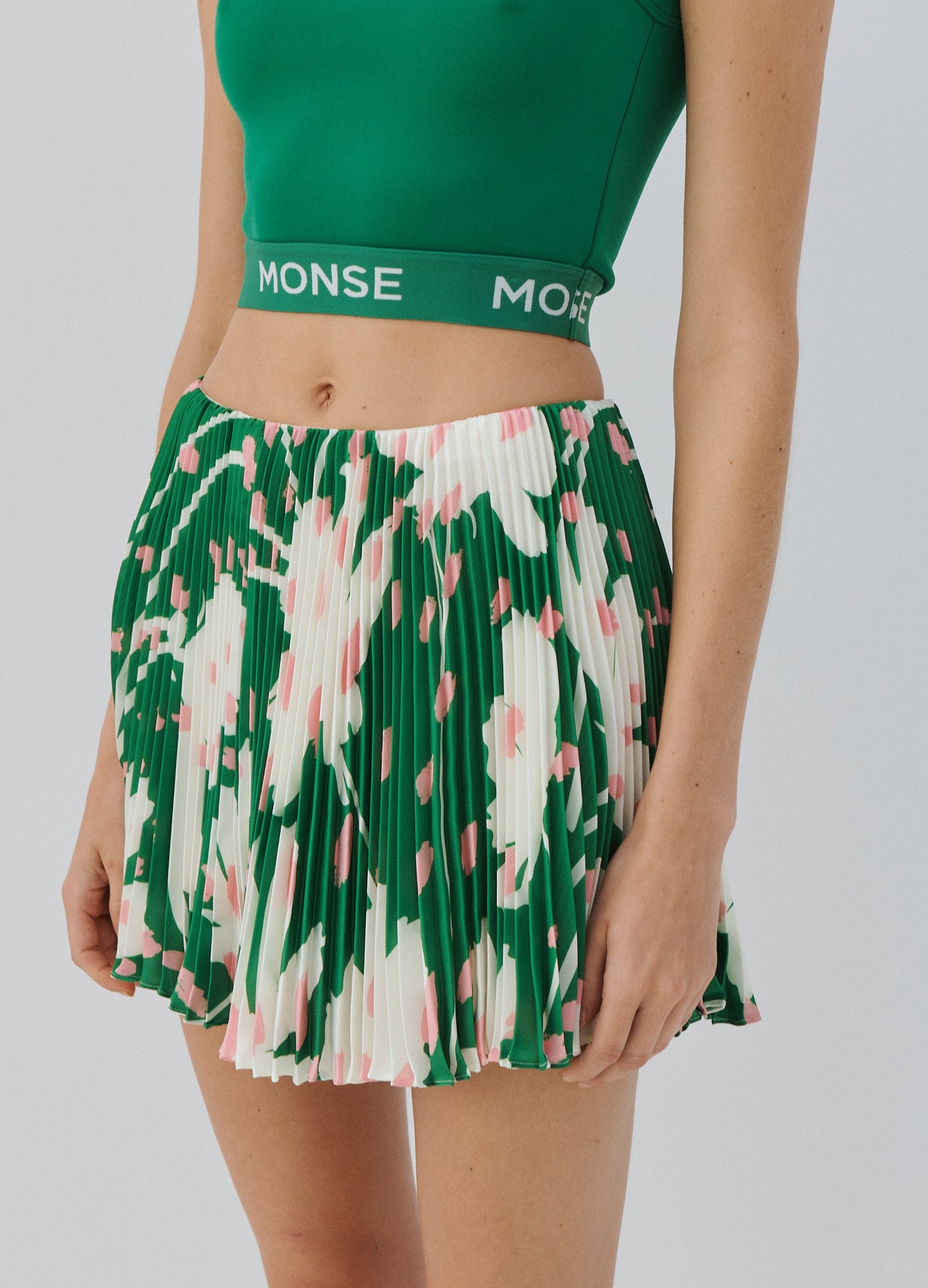 MONSE Floral Pleated Mini Skirt in Green Multi on Model Skirt Detail View