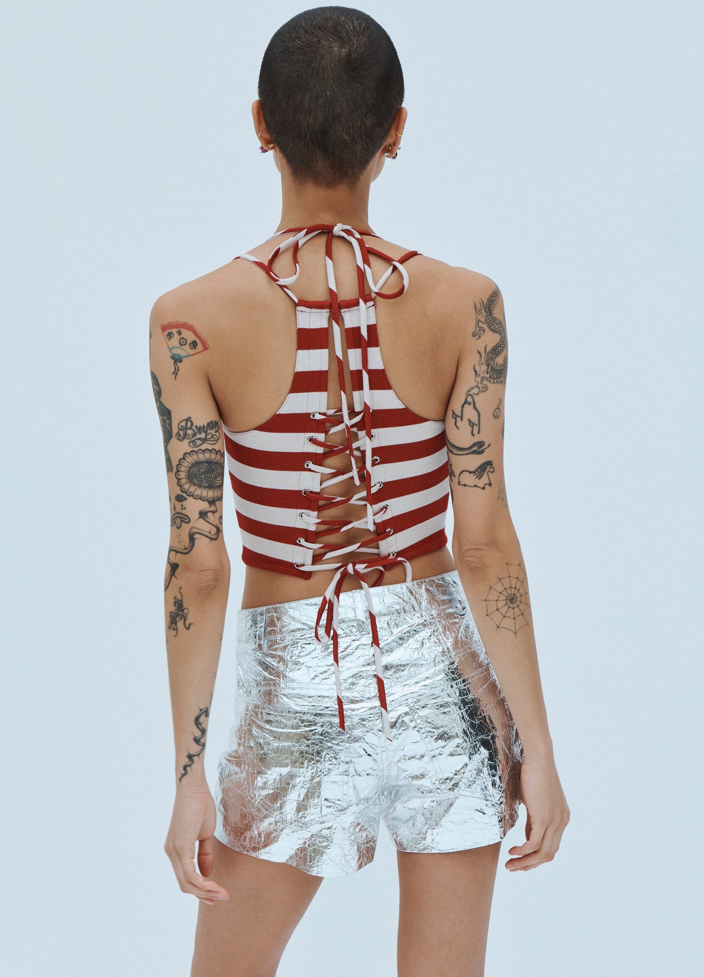 MONSE Foil Tyvek Mini Shorts in Silver on Model Back View