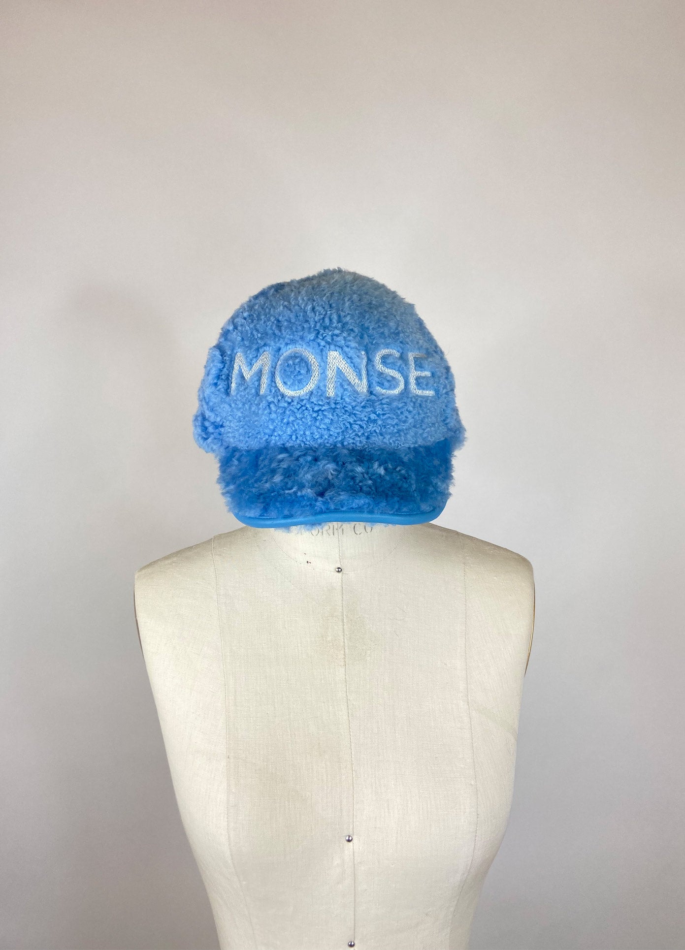 MONSE Fur Baseball Cap in Light Blue on Mannequin Head Front View