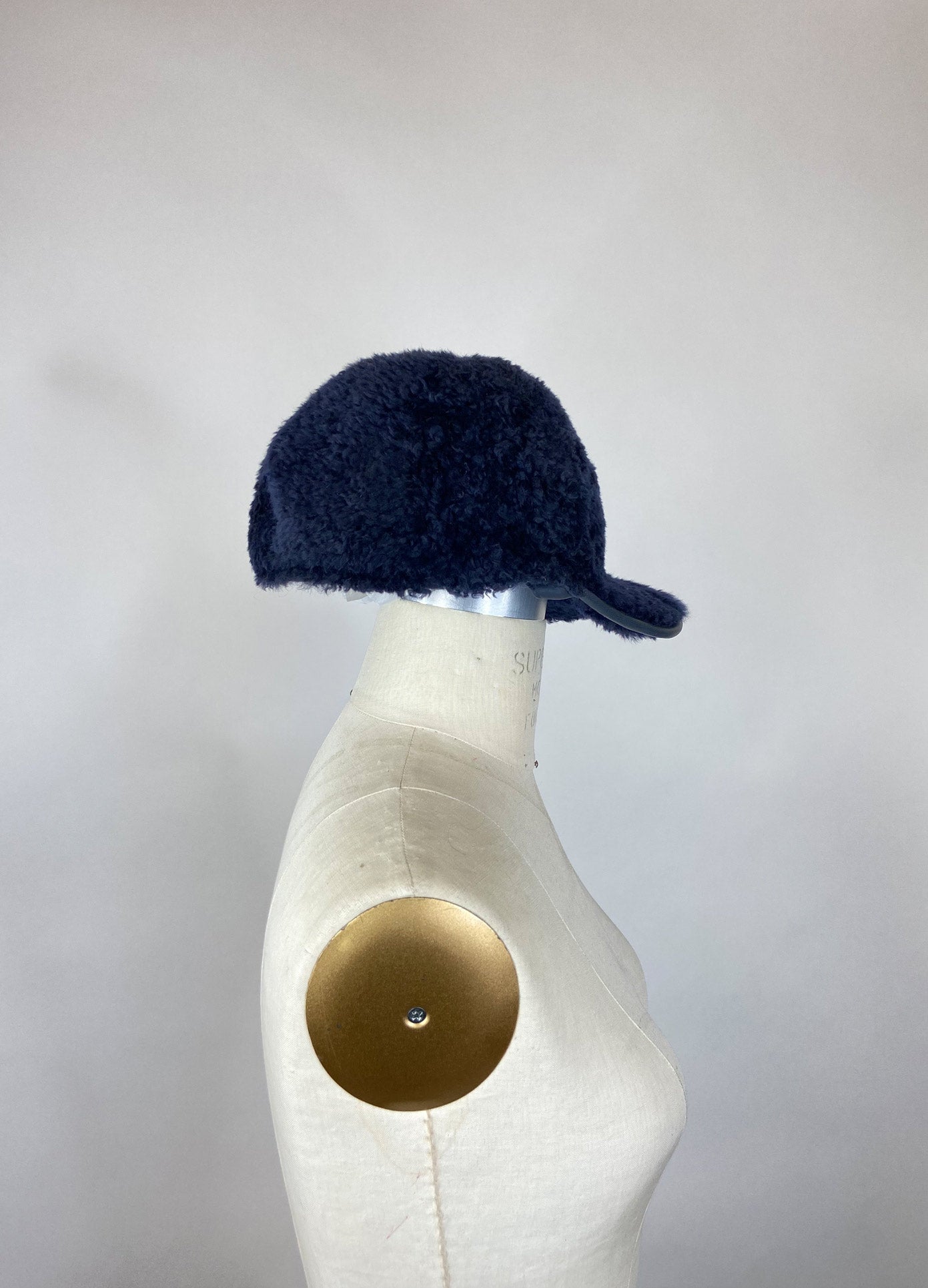 MONSE Fur Baseball Cap in Midnight on Mannequin Head Side View