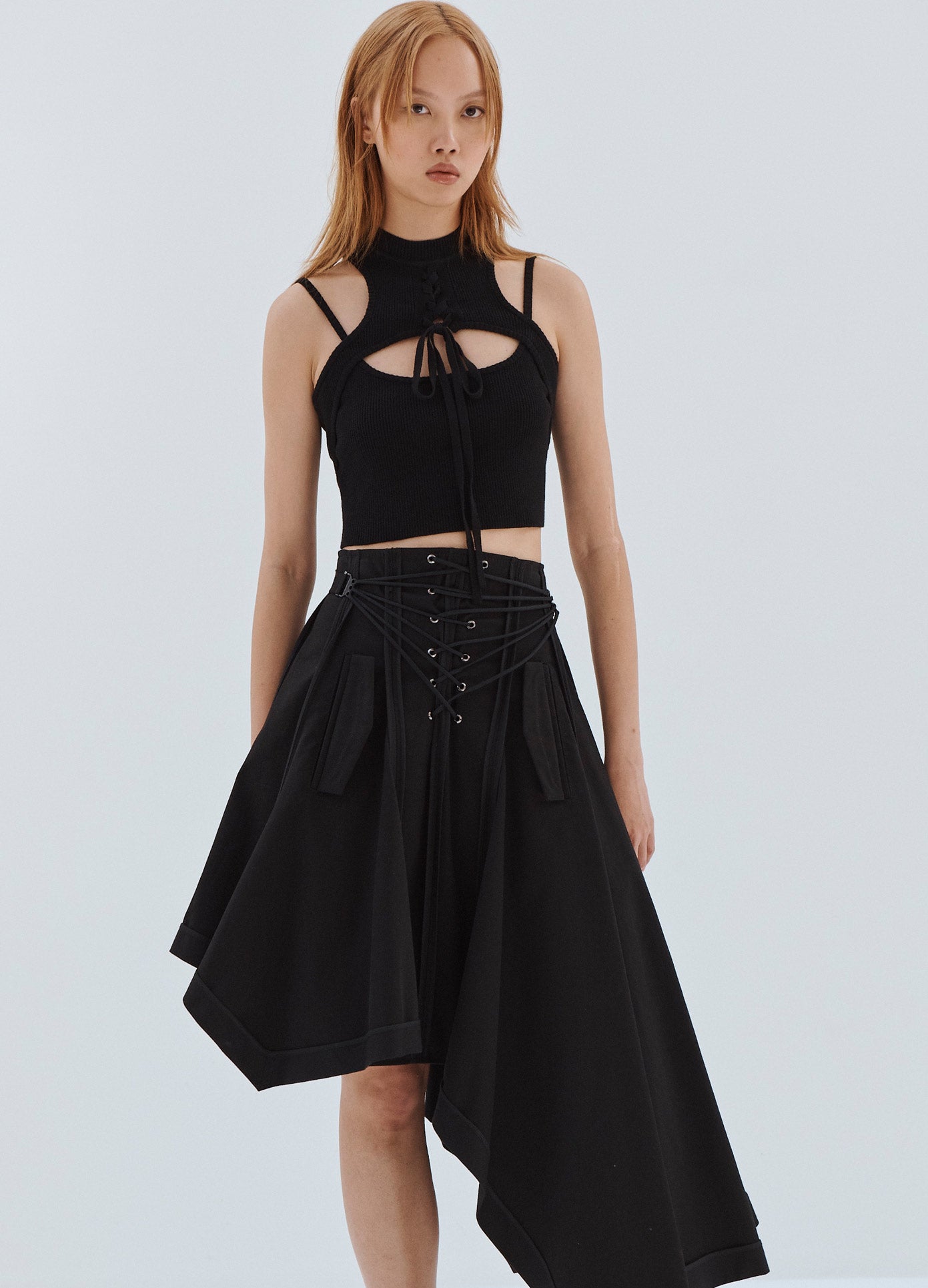 MONSE Lace Up Asymmetrical Hem Skirt in Black on Model Front Alternate View