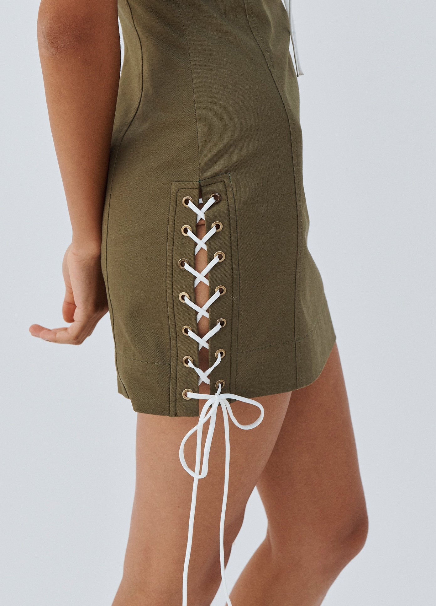 MONSE Laced Detail Mini Dress in Olive on Model Side Rope Detail View
