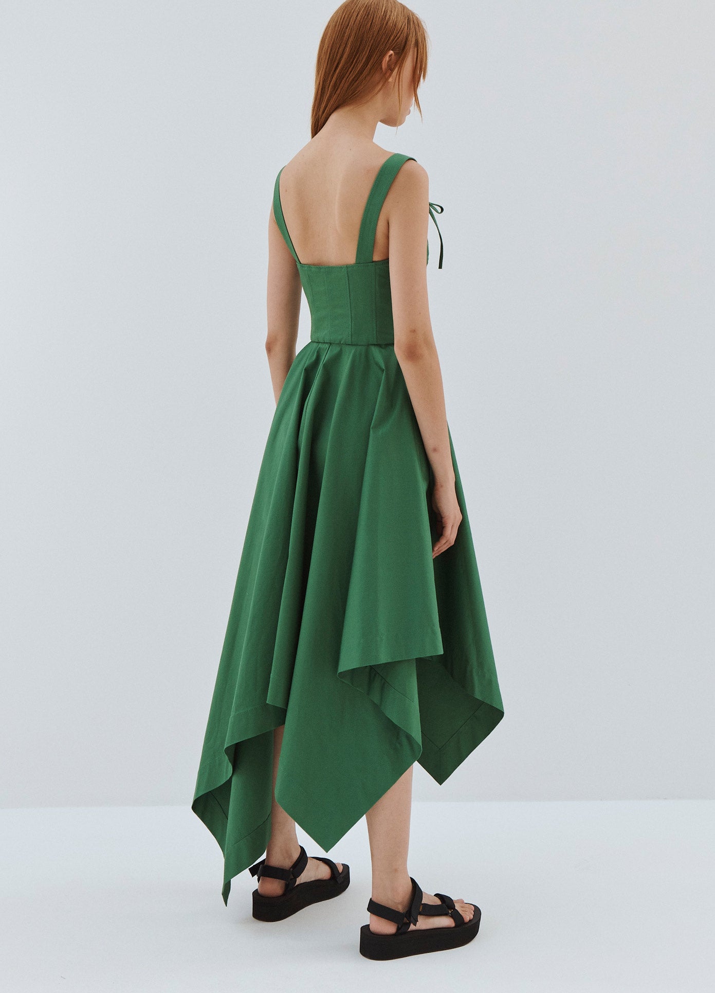 MONSE Laced Front Sleeveless Denim Dress in Green on Model Back Tilted View