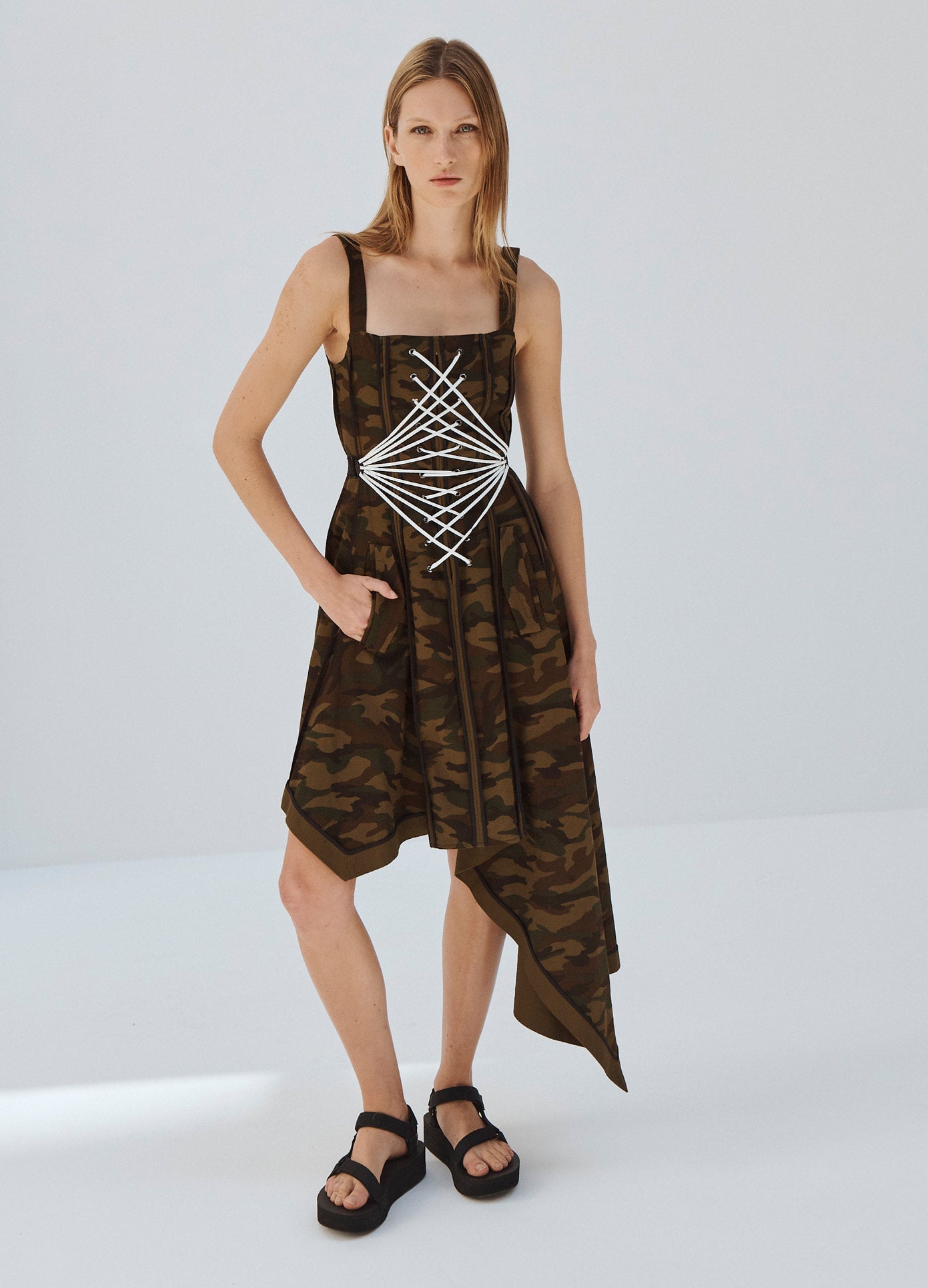 MONSE Laced Up Binding Coat Dress in Camo Print on Model Hand in Pocket Front View