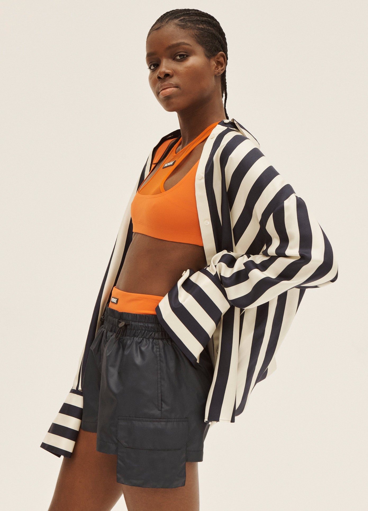 MONSE Layered Short in Midnight and Deep Orange on Model Side View